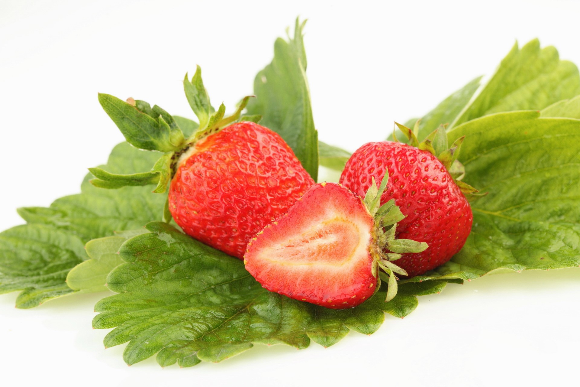 Strawberries on green leaves HD Wallpaper