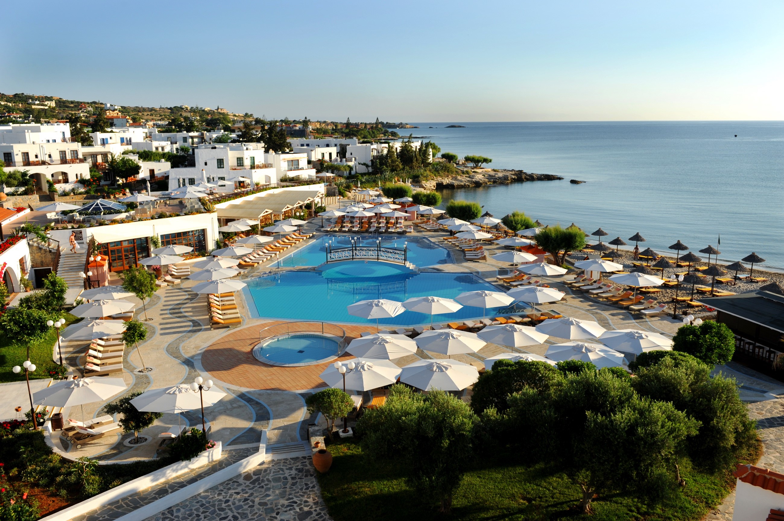 Resort with pools and beach in Greece HD Wallpaper
