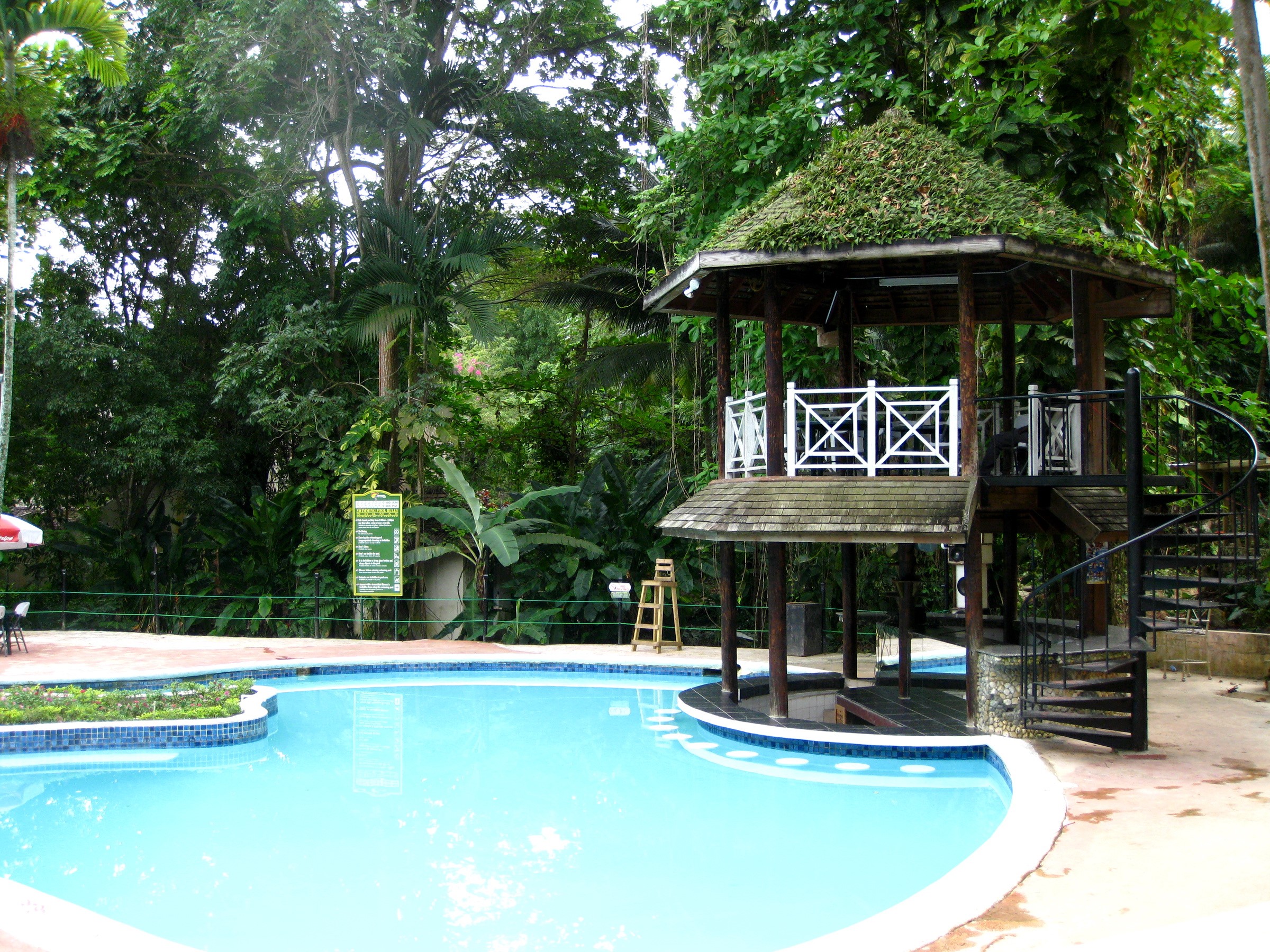 Resort pool with gazebo and spiral staircase in Ocho Rios, Jamaica HD Wallpaper