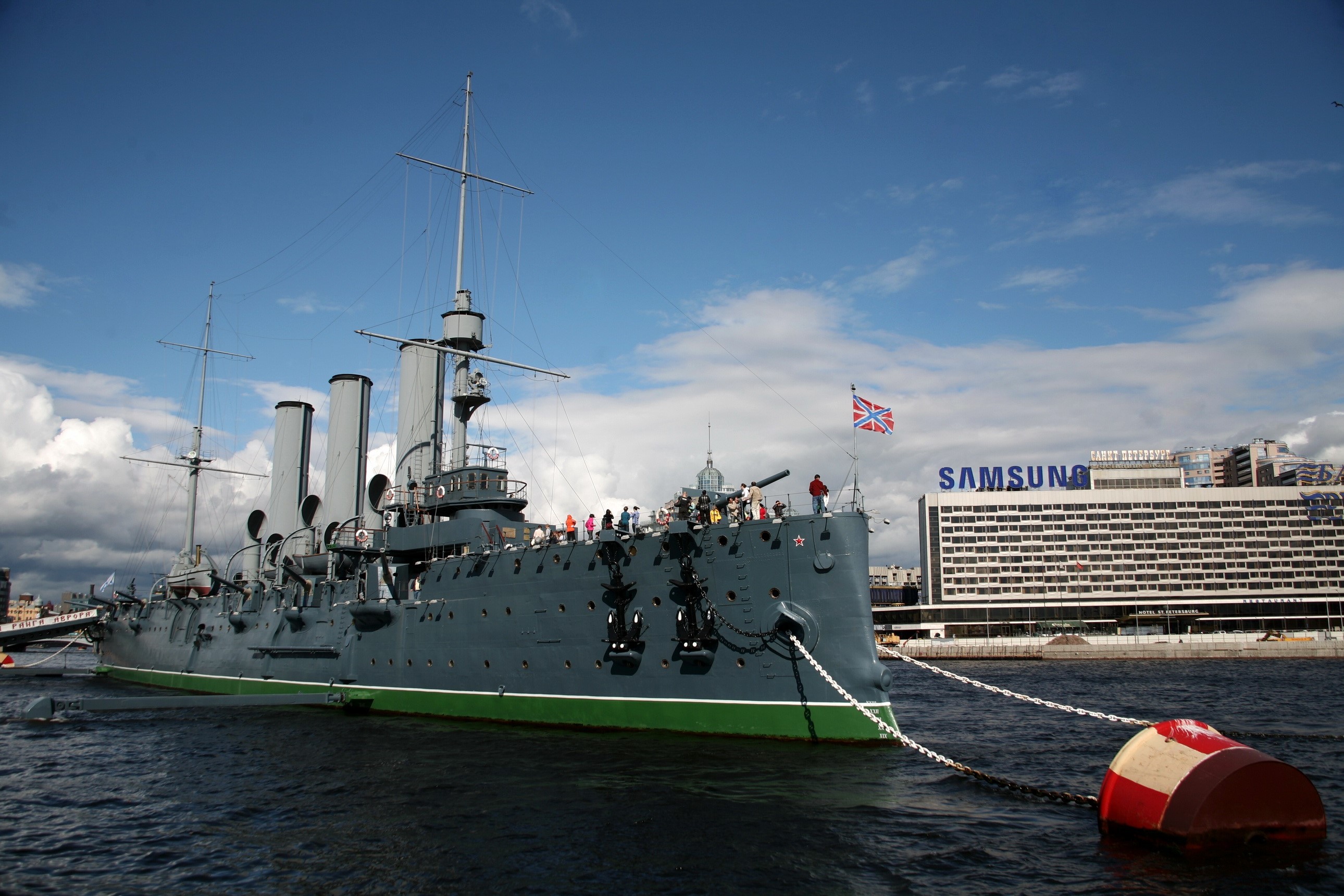 Aurora cruiser ship docked with Samsung building in background HD Wallpaper