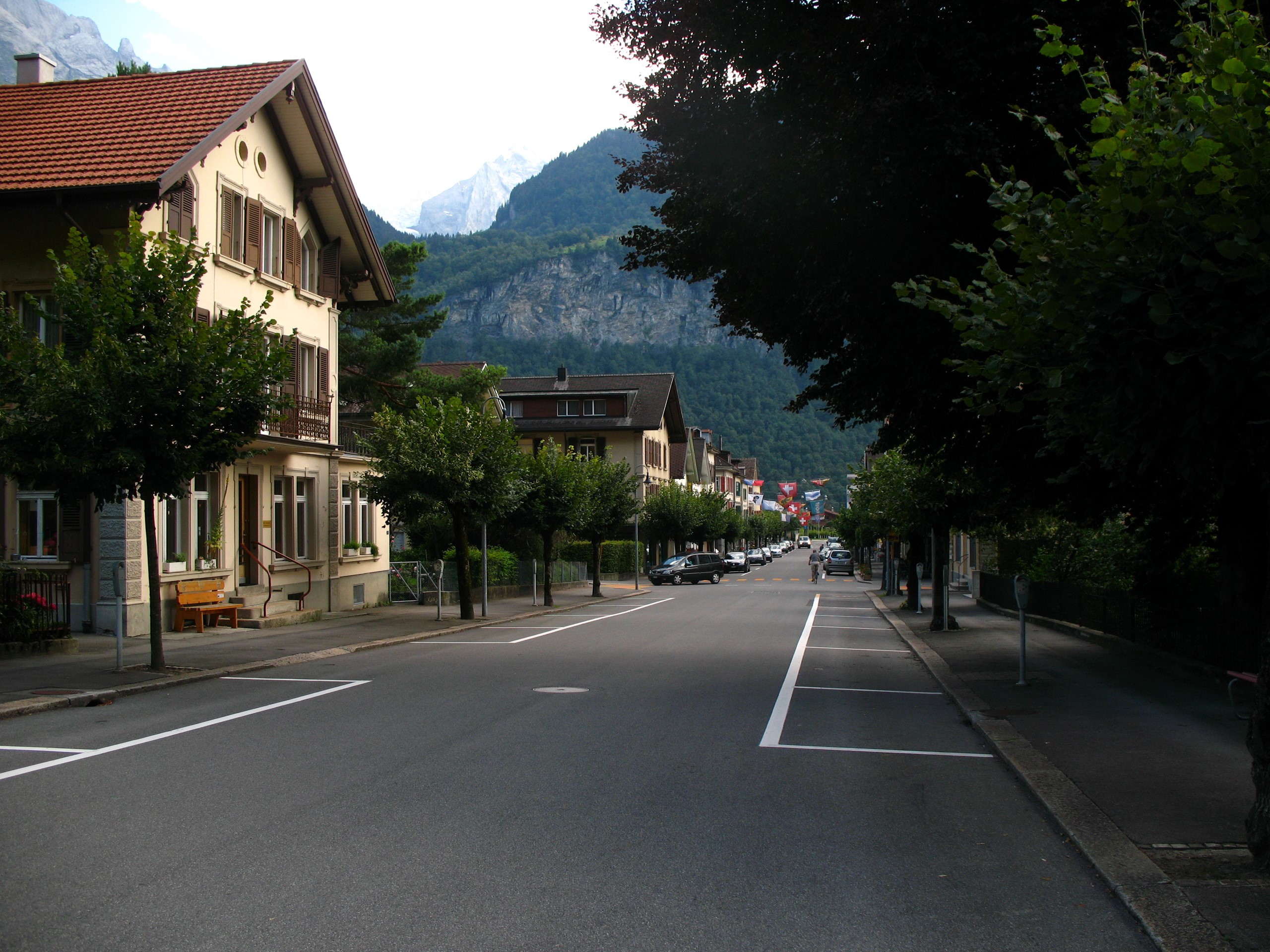Street in Meiringen, Switzerland with Mountains HD Wallpaper
