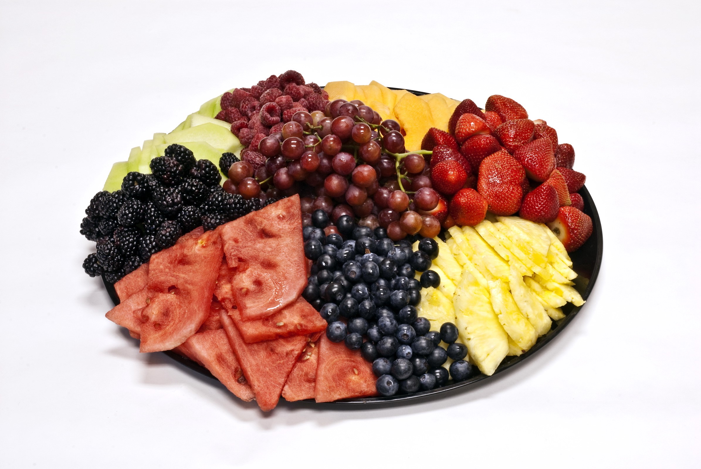 Fruit platter with strawberries, grapes, blueberries, pineapple, watermelon, cantaloupe, blackberries, and raspberries HD Wallpaper
