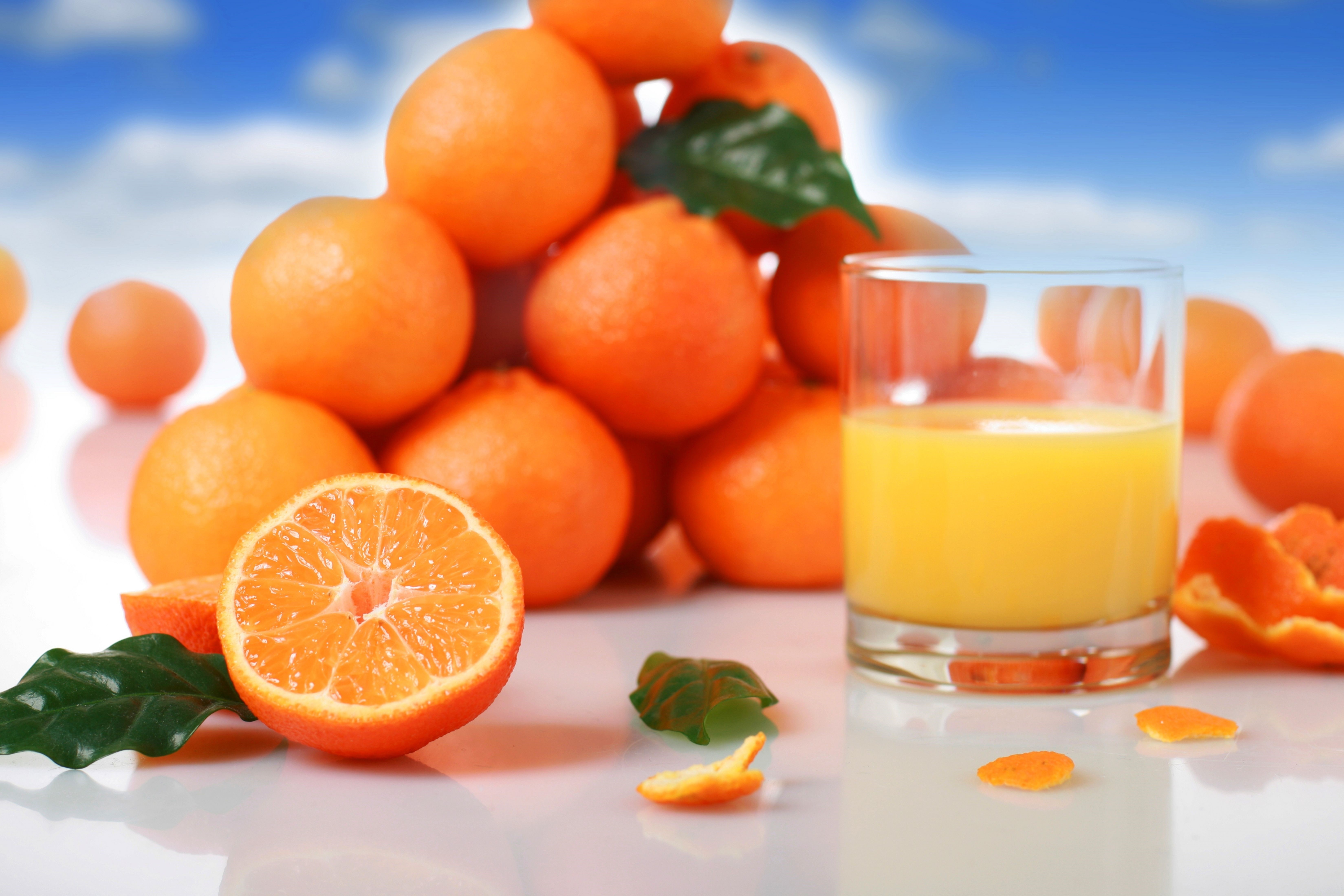 Oranges and orange juice in a glass HD Wallpaper