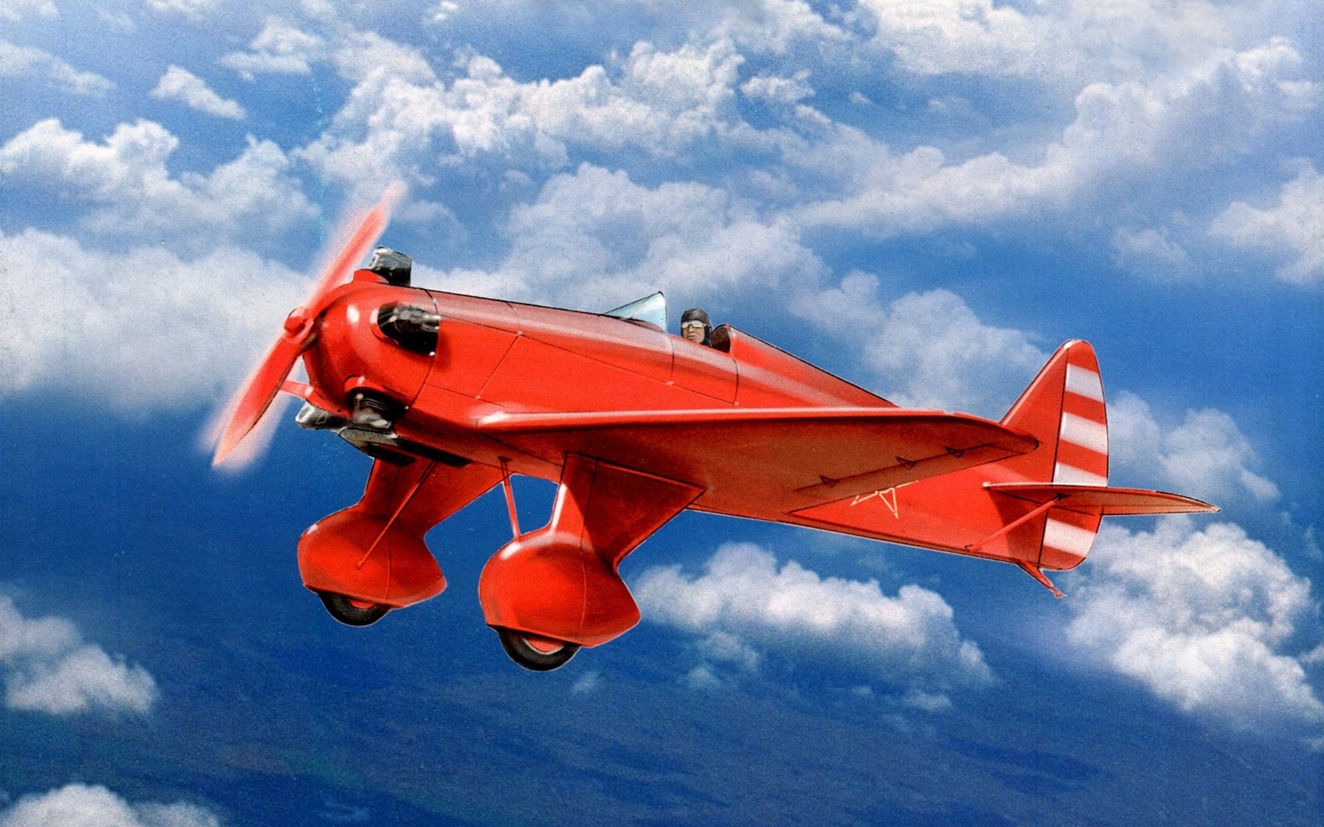 Red biplane flying in a blue sky with clouds HD Wallpaper