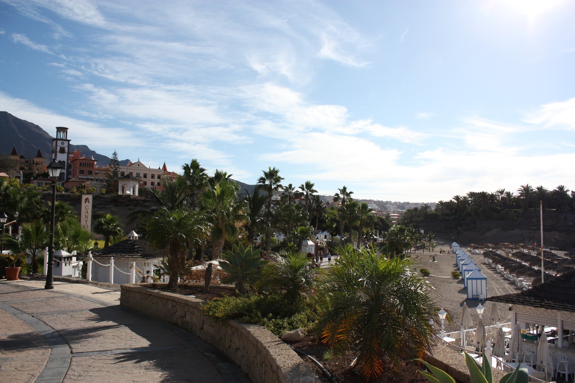 Beach resort with palm trees and buildings in Spain HD Wallpaper