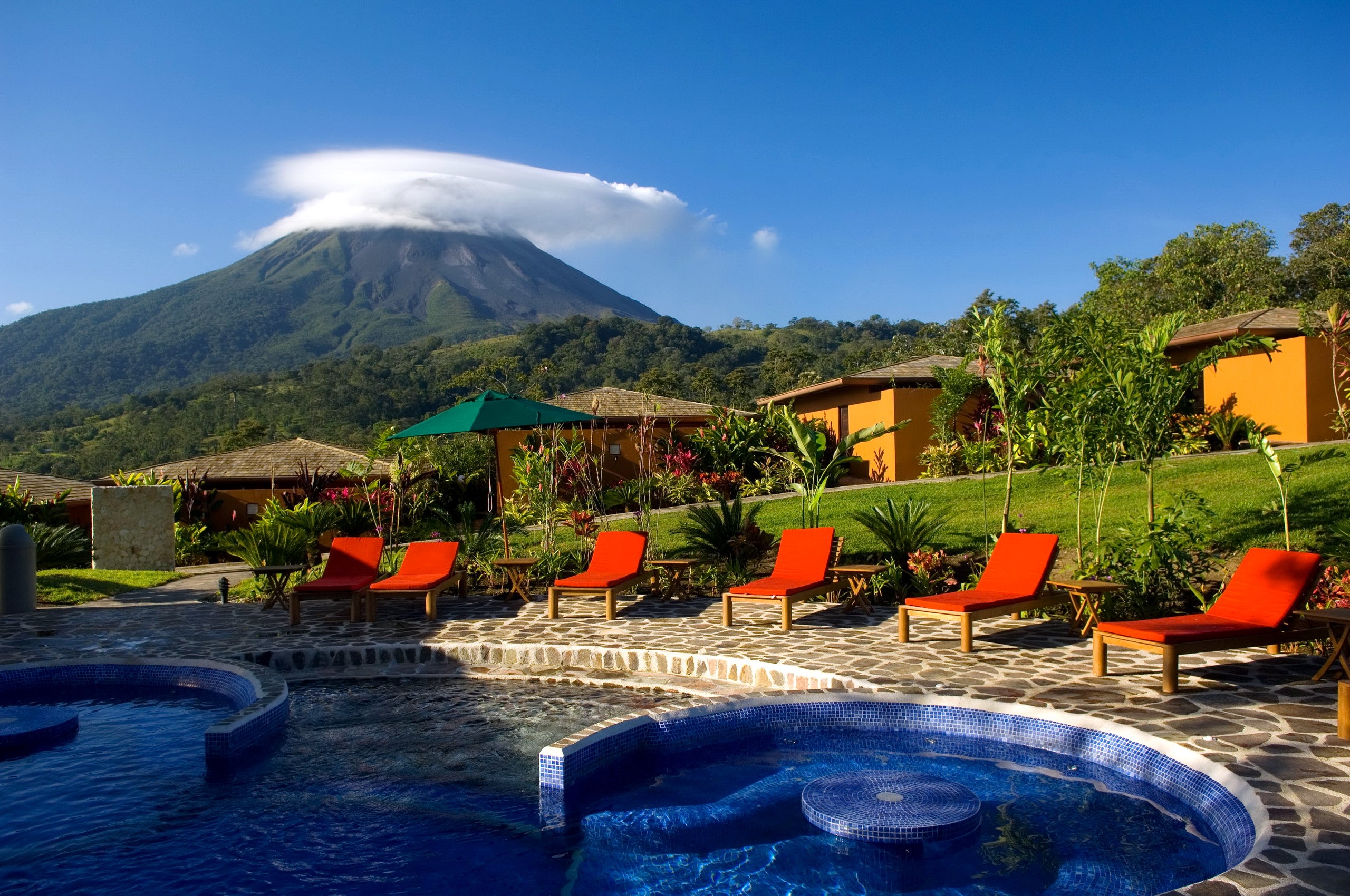 Resort with pools and volcano view HD Wallpaper