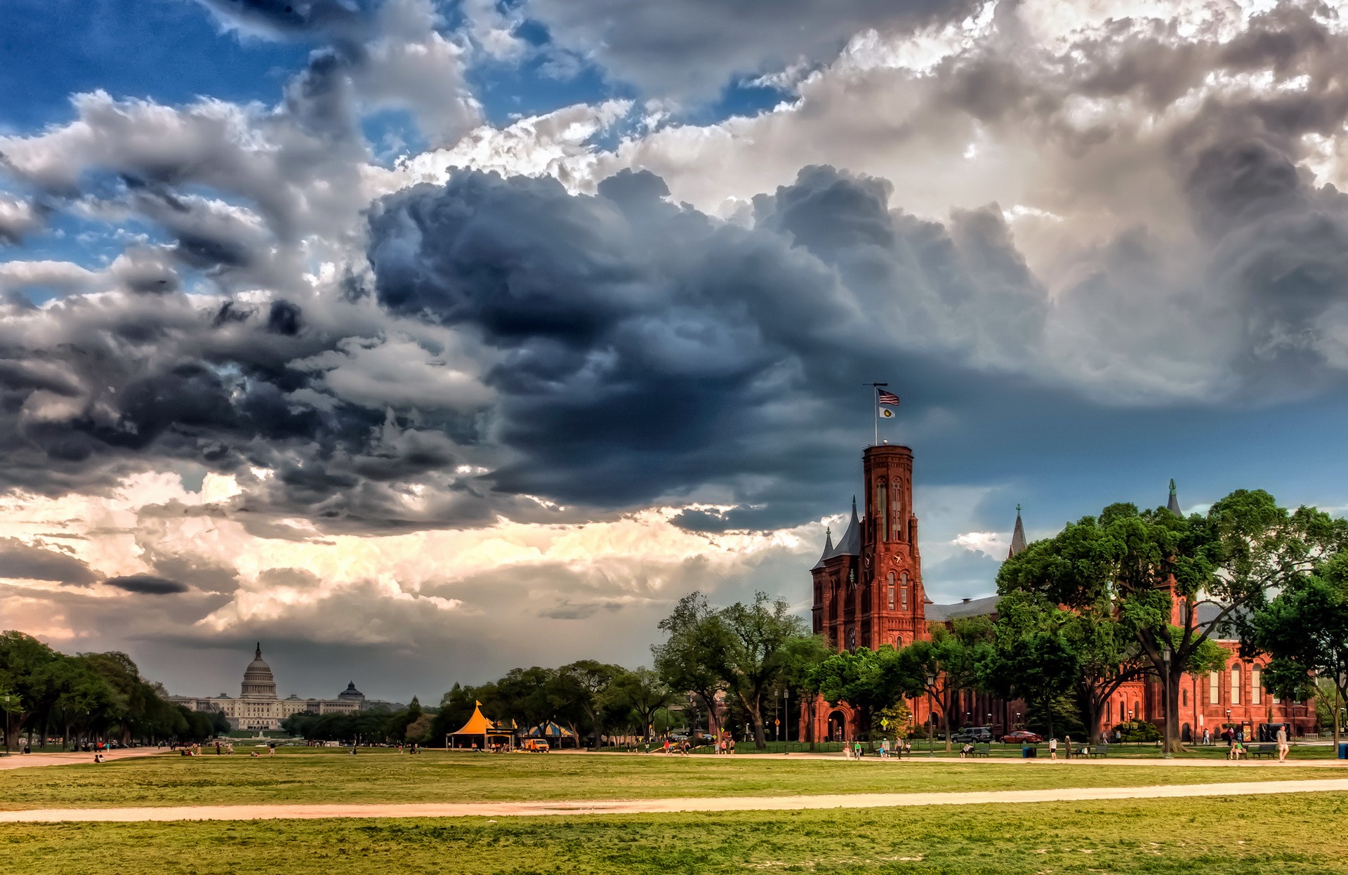 Washington Monument and Capitol Building under stormy clouds HD Wallpaper
