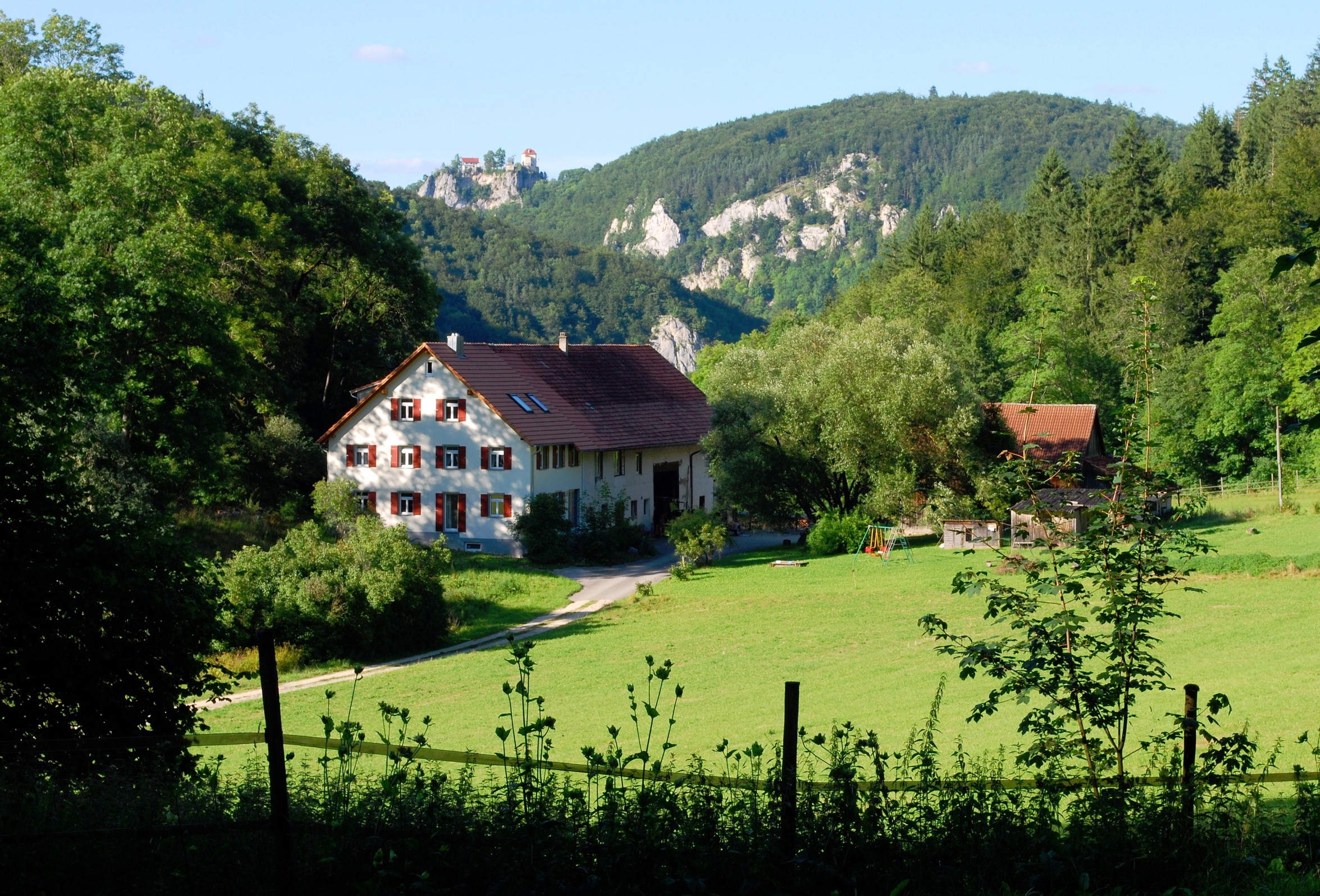 Houses in a German landscape with a castle on a hill HD Wallpaper