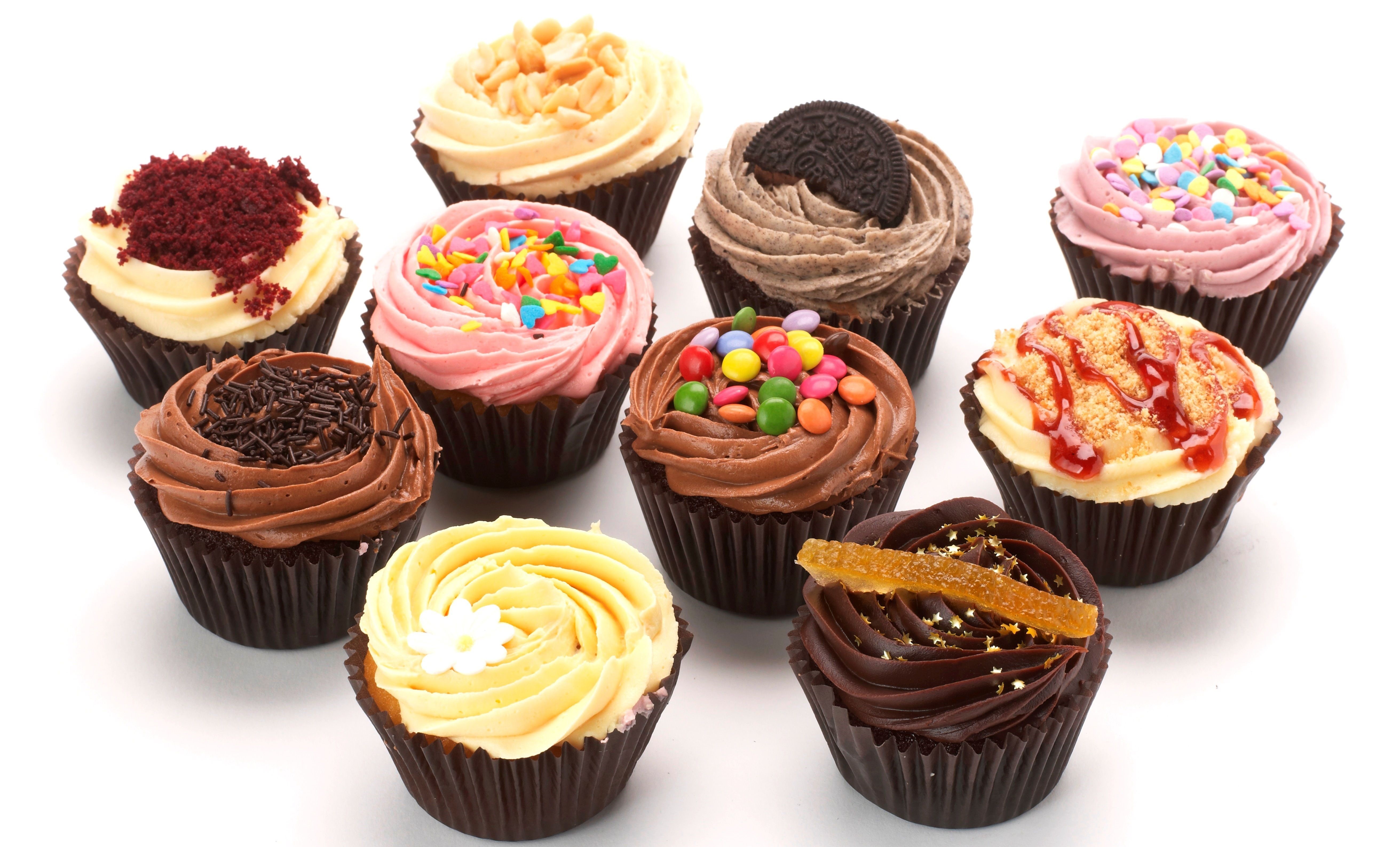 Assortment of Decorated Cupcakes HD Wallpaper