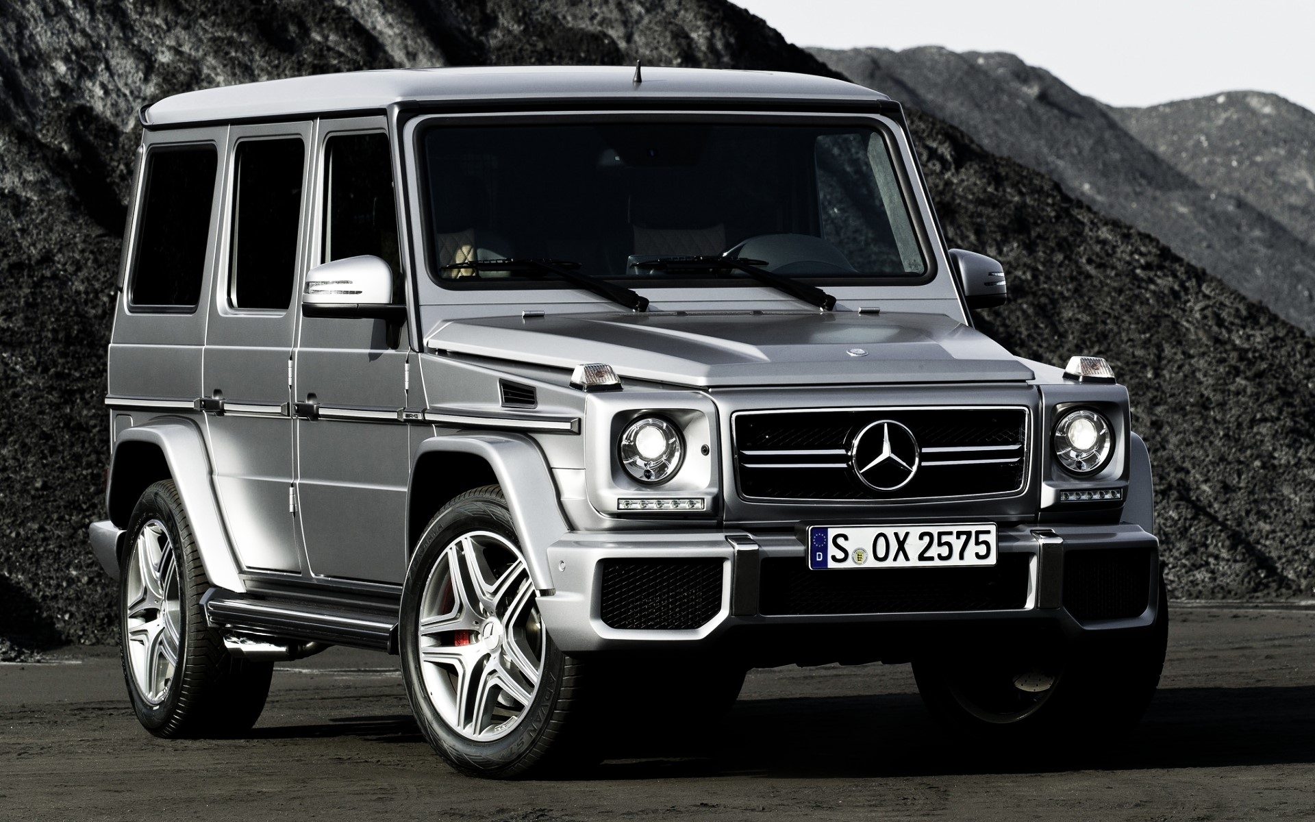 Silver Mercedes-Benz G-Class SUV on a rocky terrain HD Wallpaper