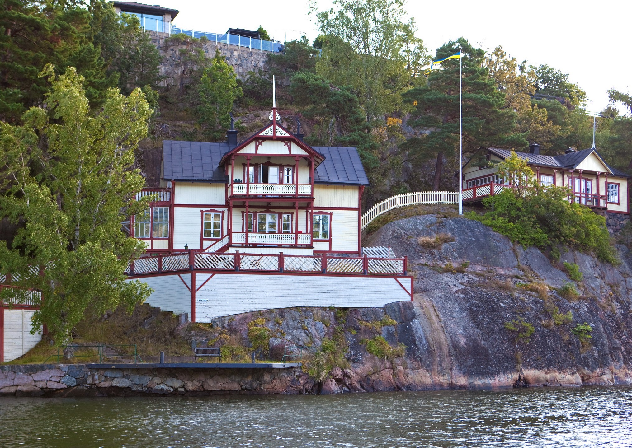 Two houses on a rocky cliffside in Sweden HD Wallpaper