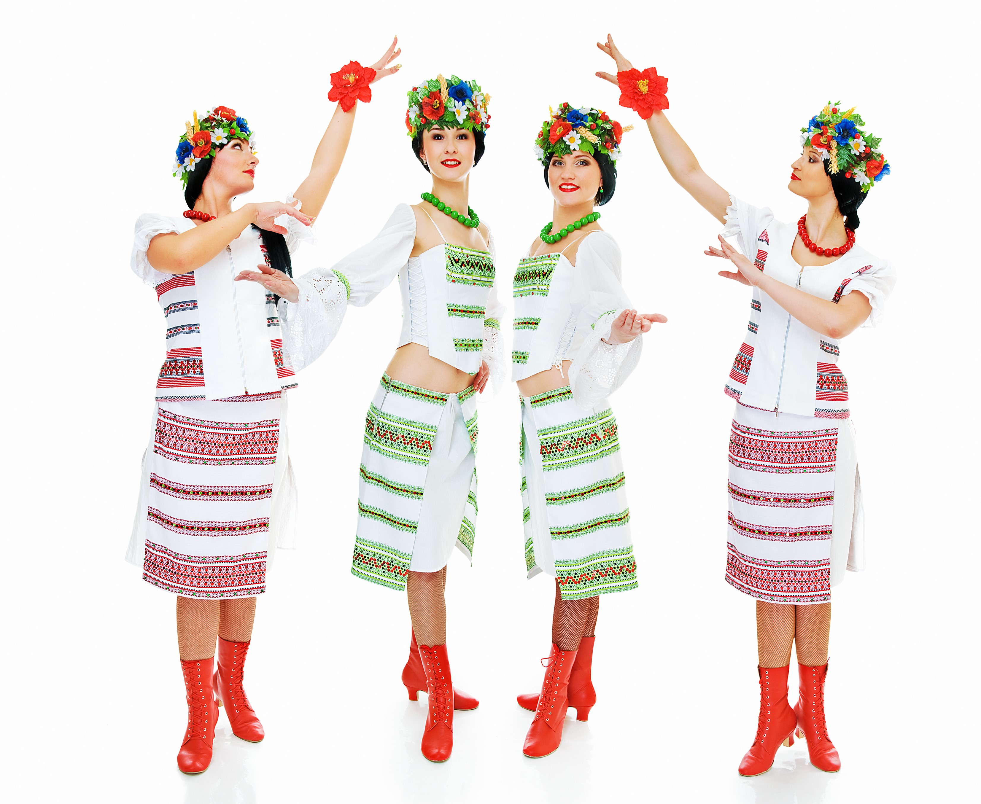 Four women in traditional Ukrainian costumes dancing HD Wallpaper