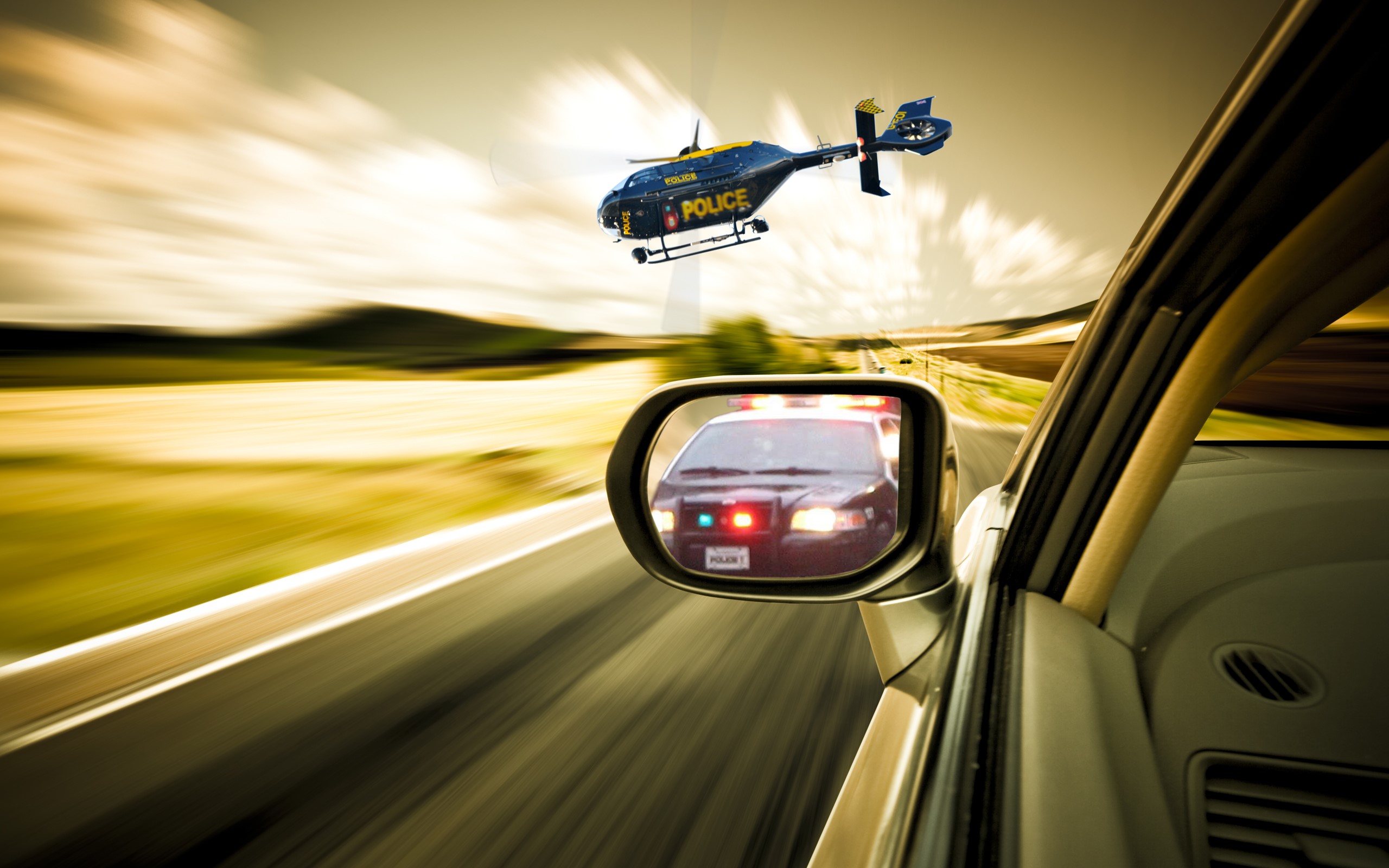 Police helicopter and police car in pursuit HD Wallpaper