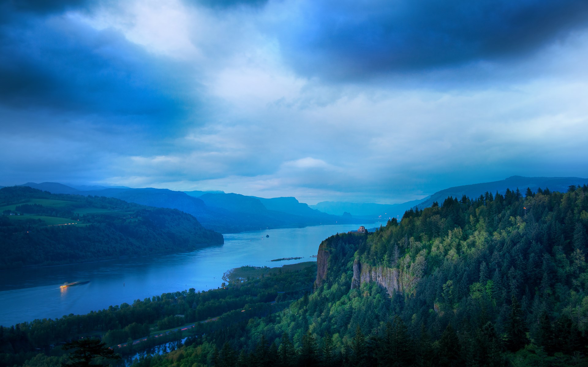River valley with forested cliffs and cloudy sky HD Wallpaper