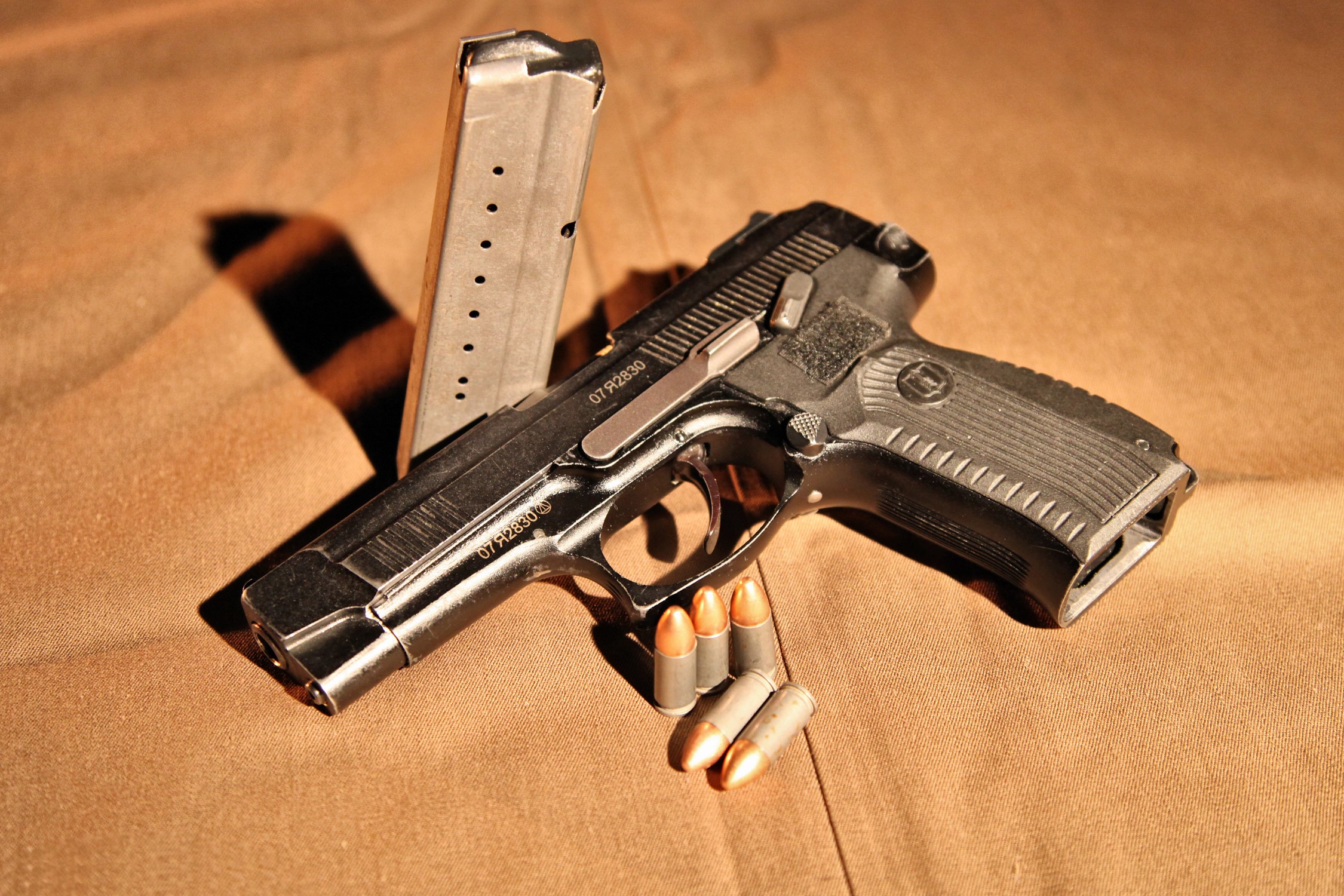Pistol with magazine and bullets HD Wallpaper