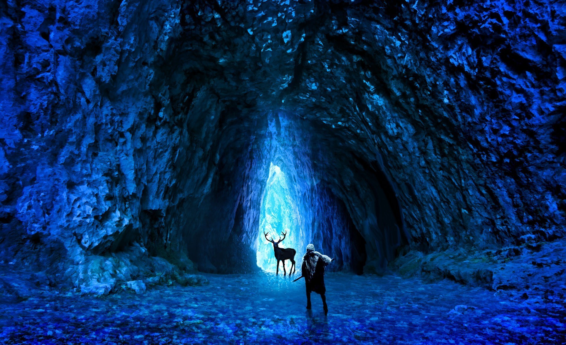 Man and deer in a glowing blue cave HD Wallpaper
