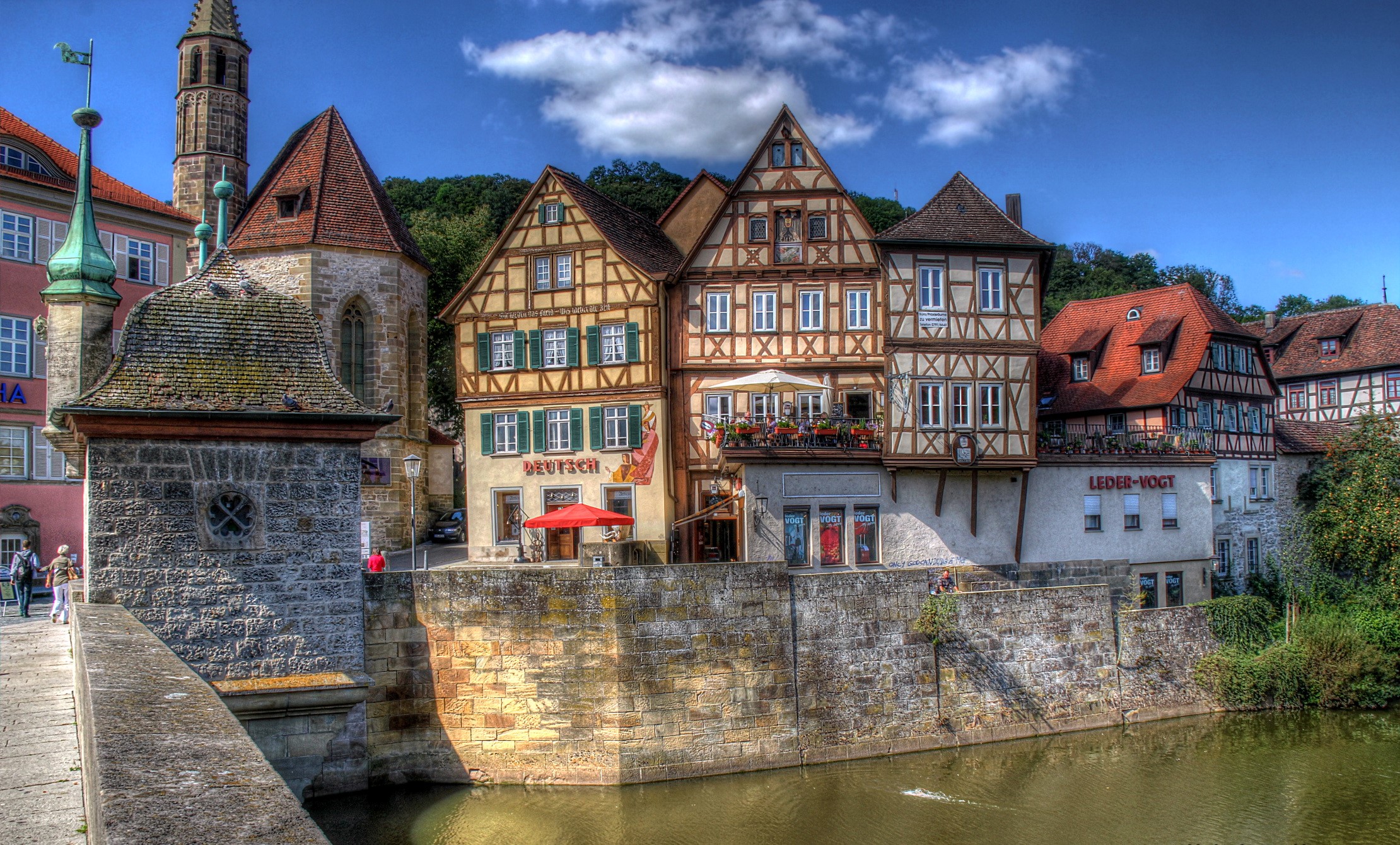 Half-timbered houses along a river in Germany HD Wallpaper
