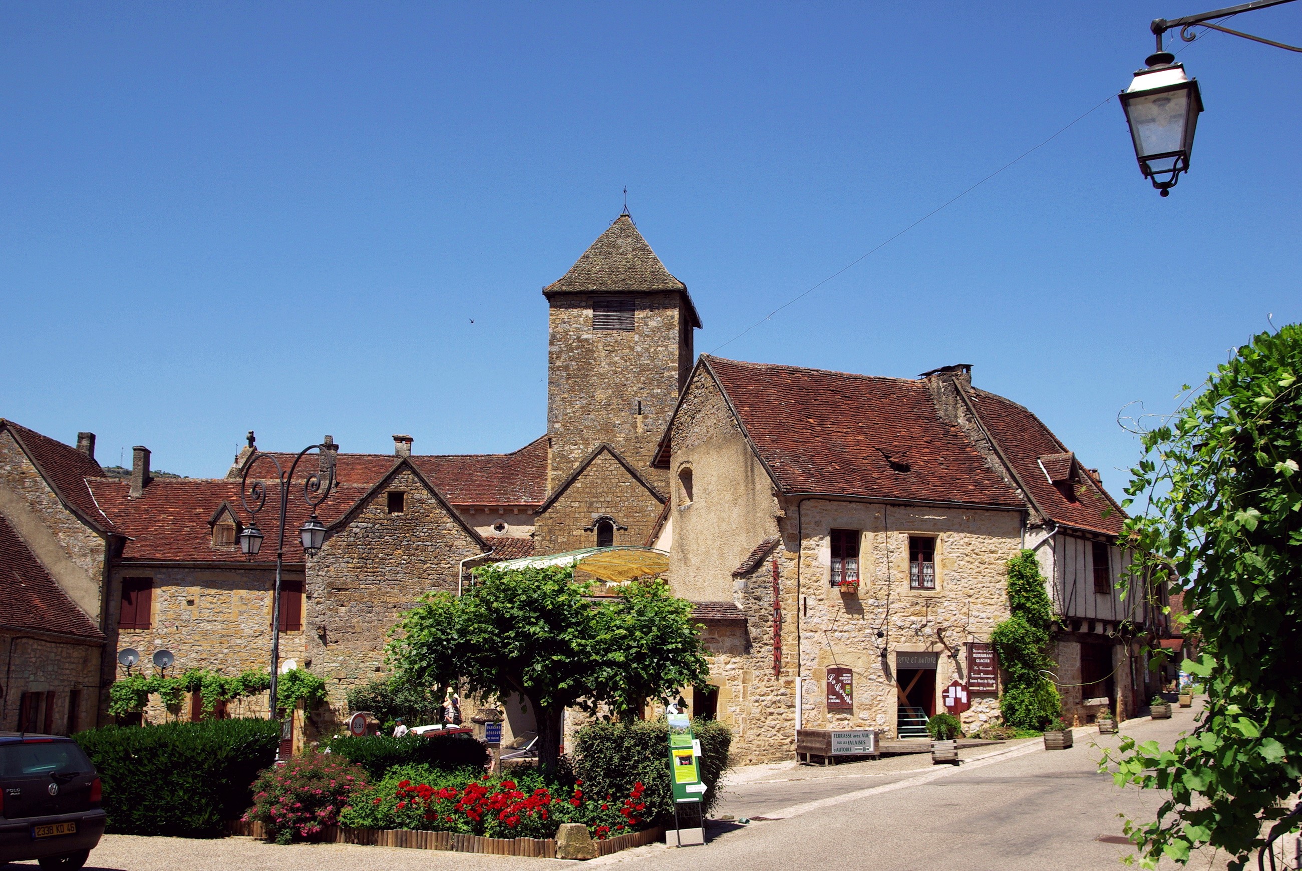 Stone buildings and a tower in a French village HD Wallpaper