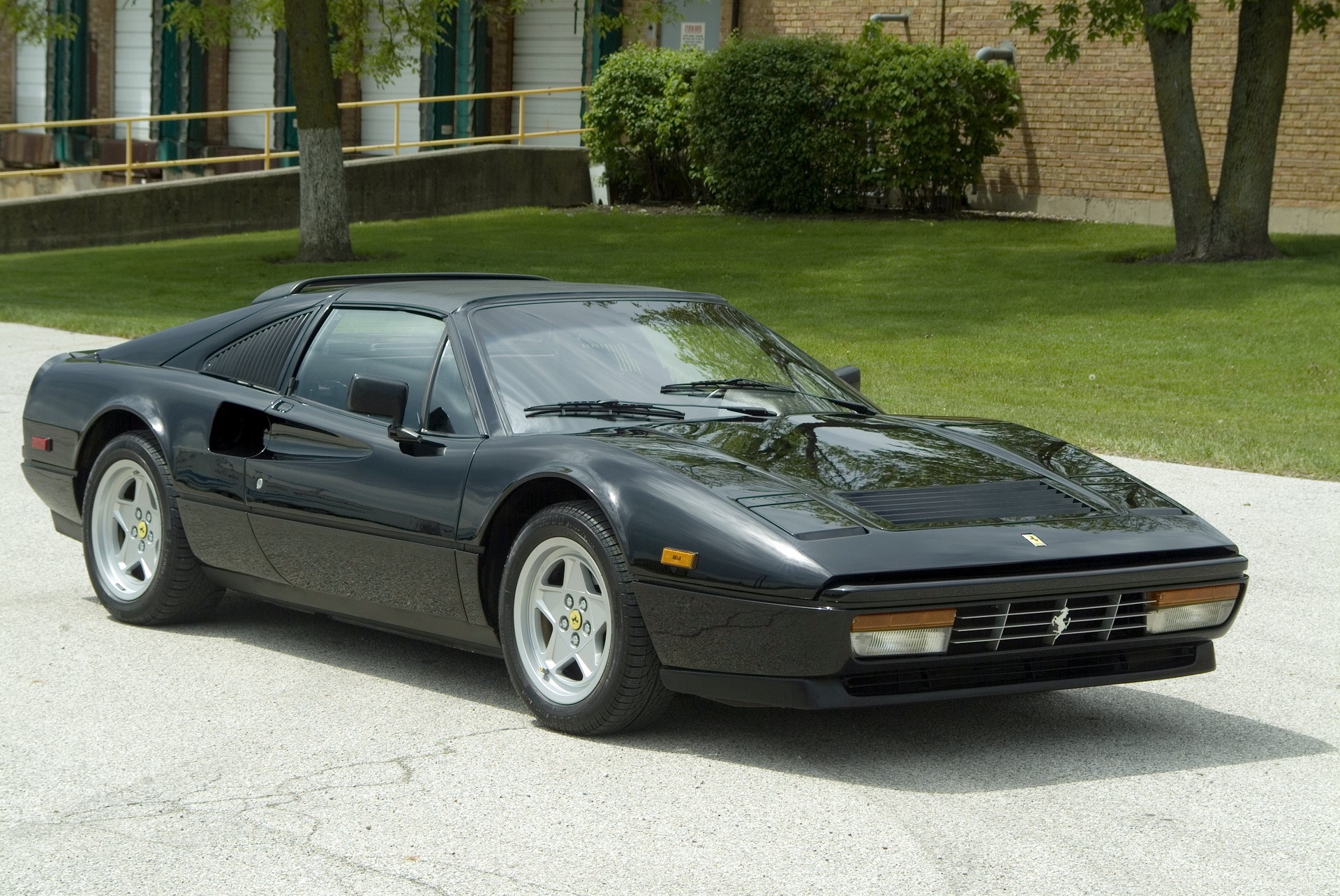 Black 1987 Ferrari 328 GTS parked outdoors HD Wallpaper