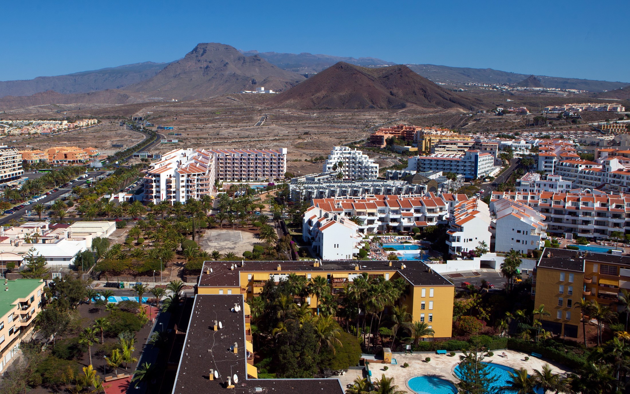 Resort town with mountains in the background, Canary Islands, Spain HD Wallpaper