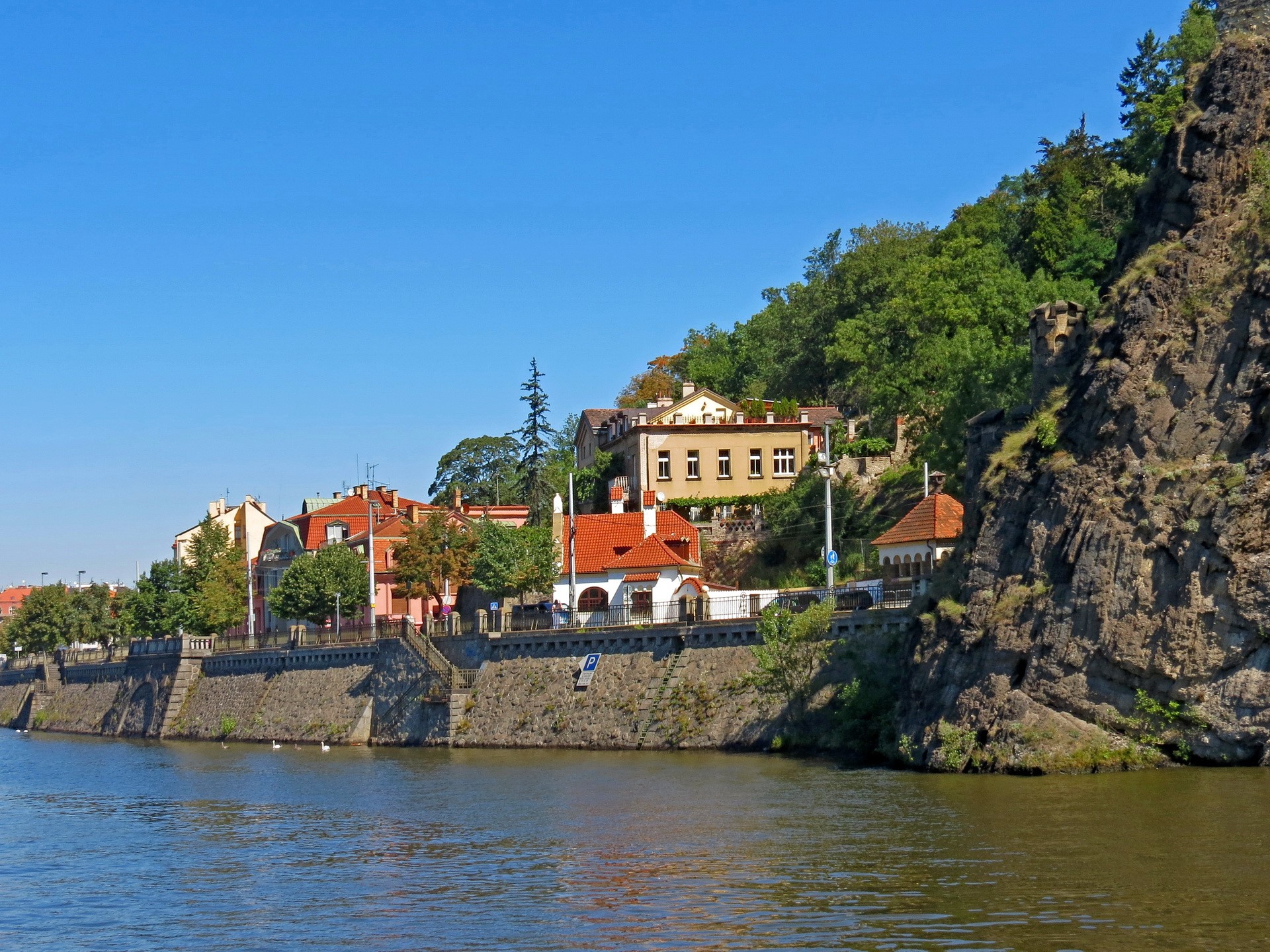 Riverfront buildings and rocky cliff in Prague, Czech Republic HD Wallpaper