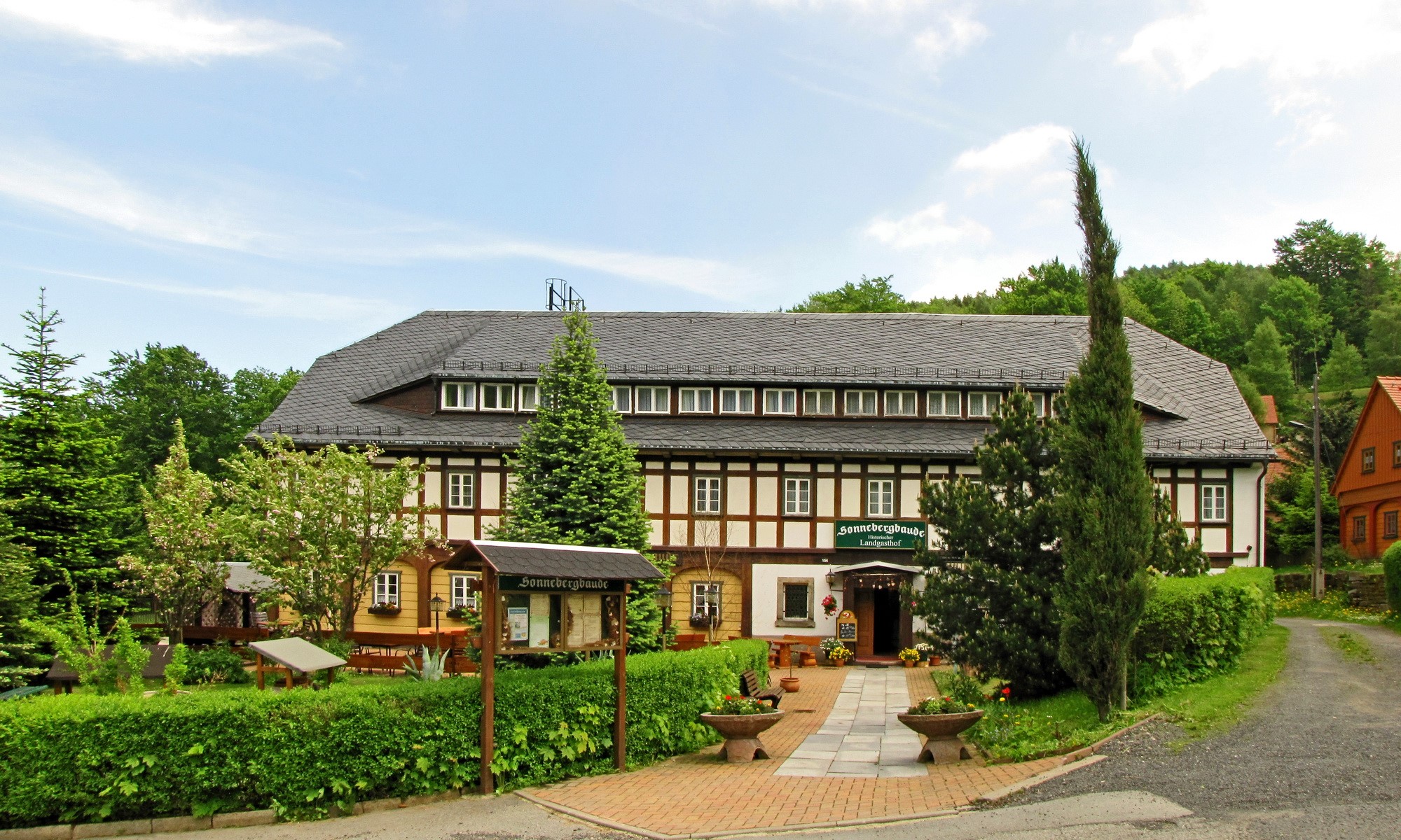 Half-timbered guesthouse in a German village HD Wallpaper