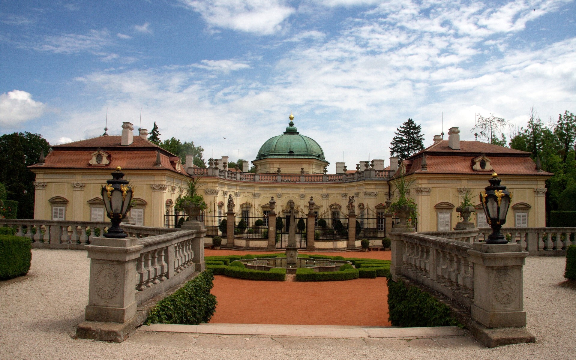 Palace with a dome and manicured gardens HD Wallpaper