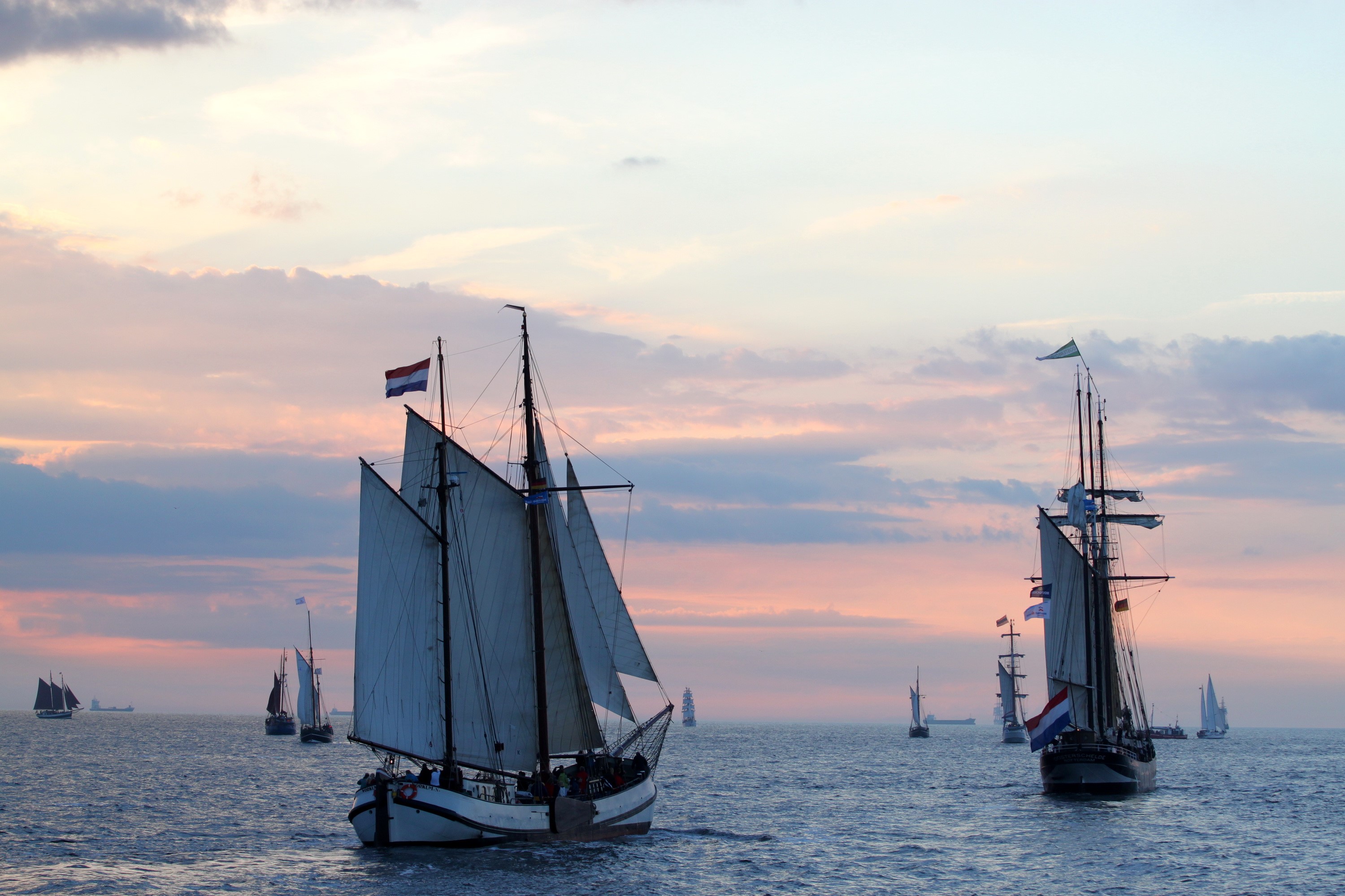 Sailing ships on the water at sunset HD Wallpaper