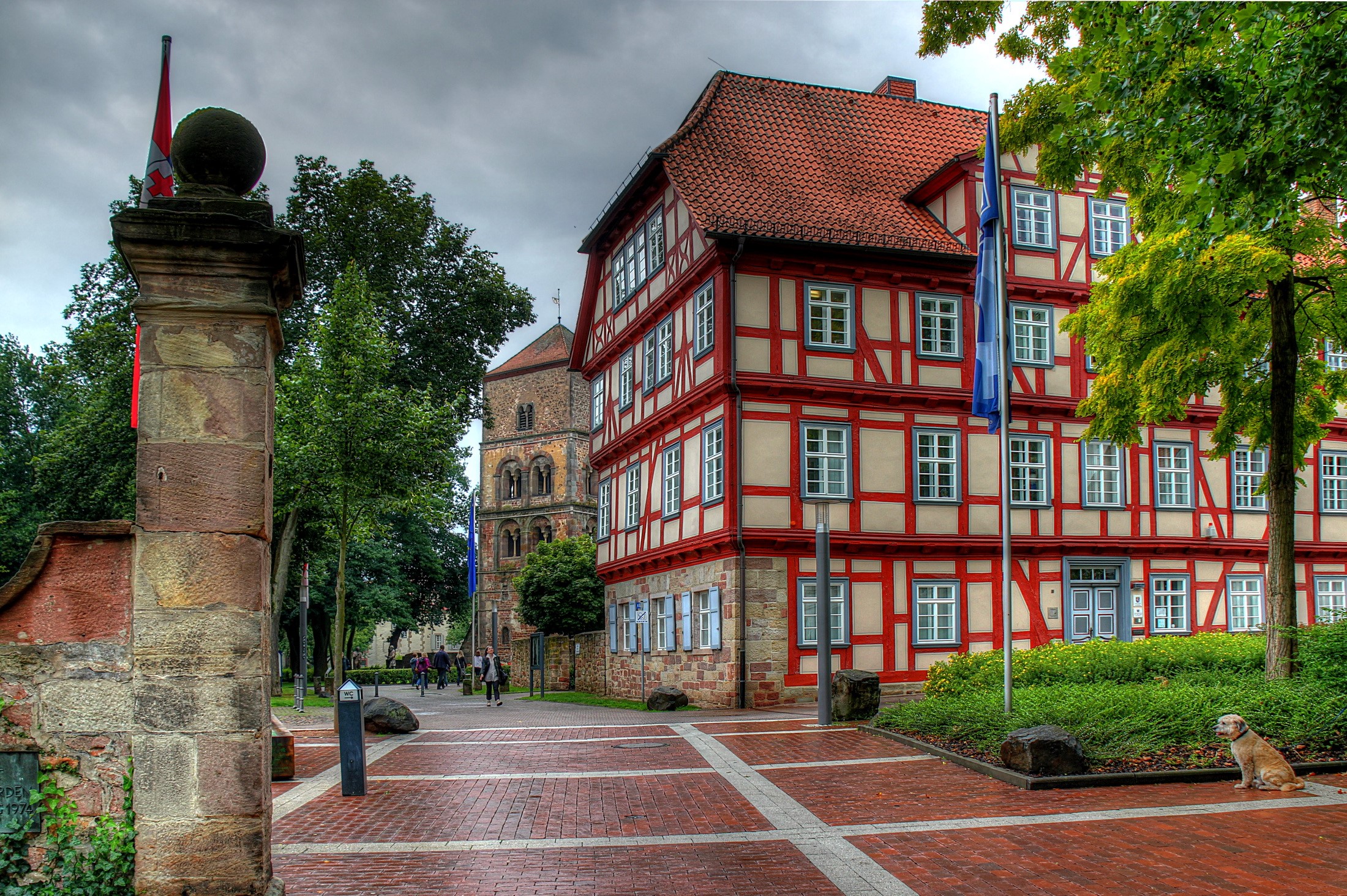 Half-timbered building and church tower in Germany HD Wallpaper