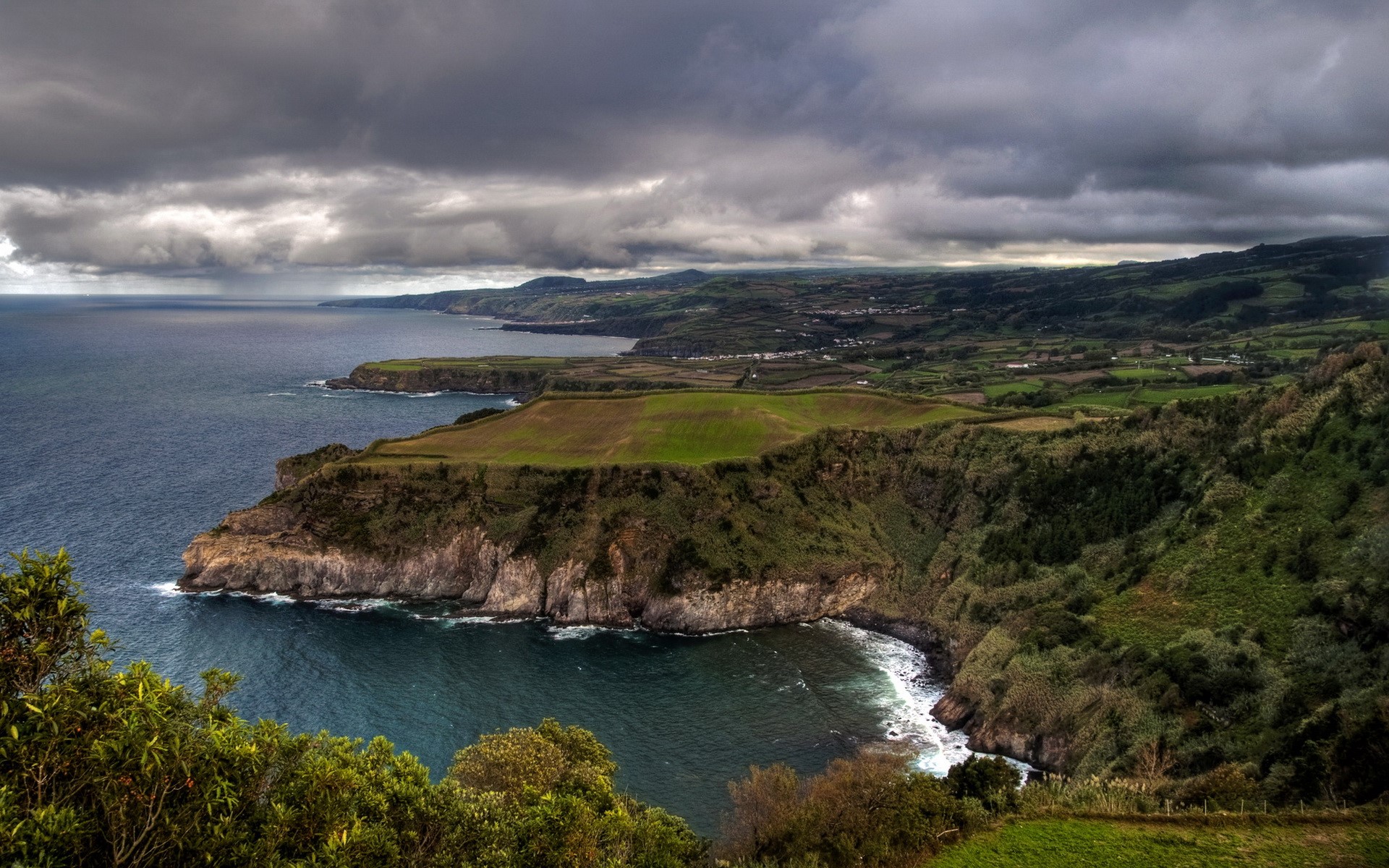 Dramatic Coastline with Overcast Sky HD Wallpaper