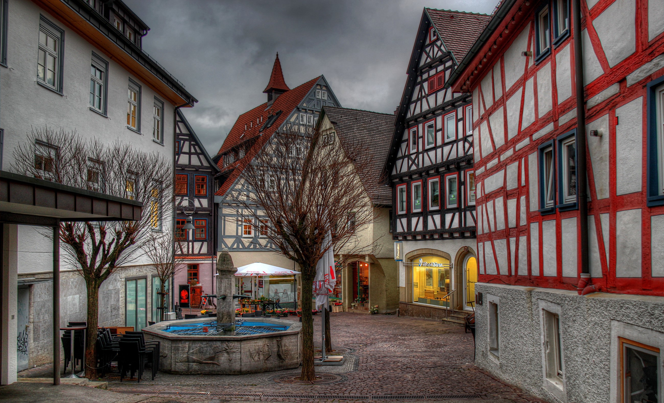 Half-timbered houses and fountain in Germany HD Wallpaper