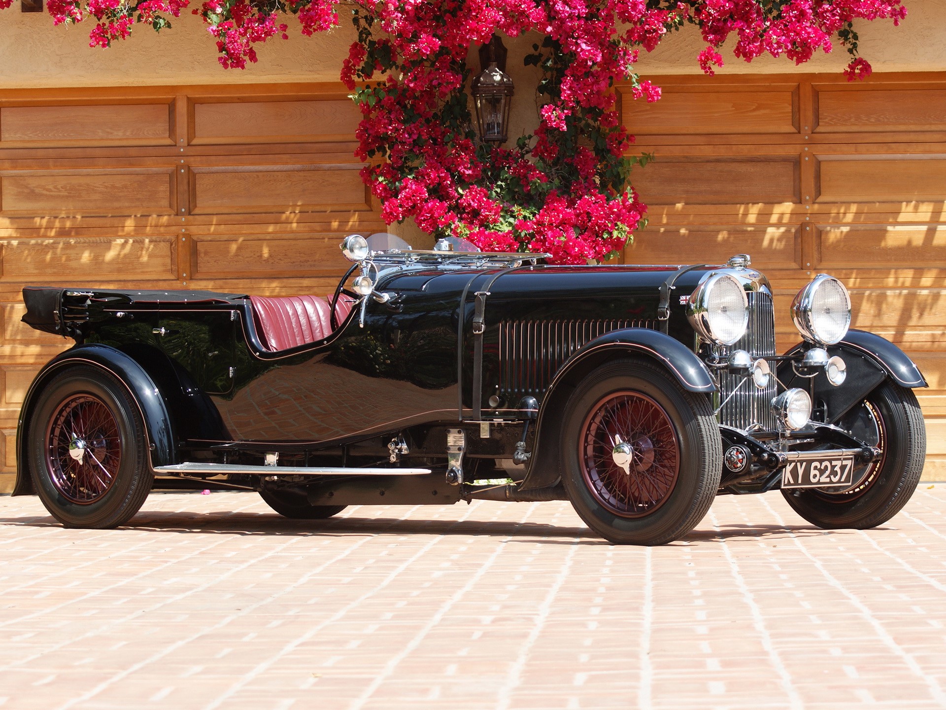 Black vintage convertible car with red interior HD Wallpaper