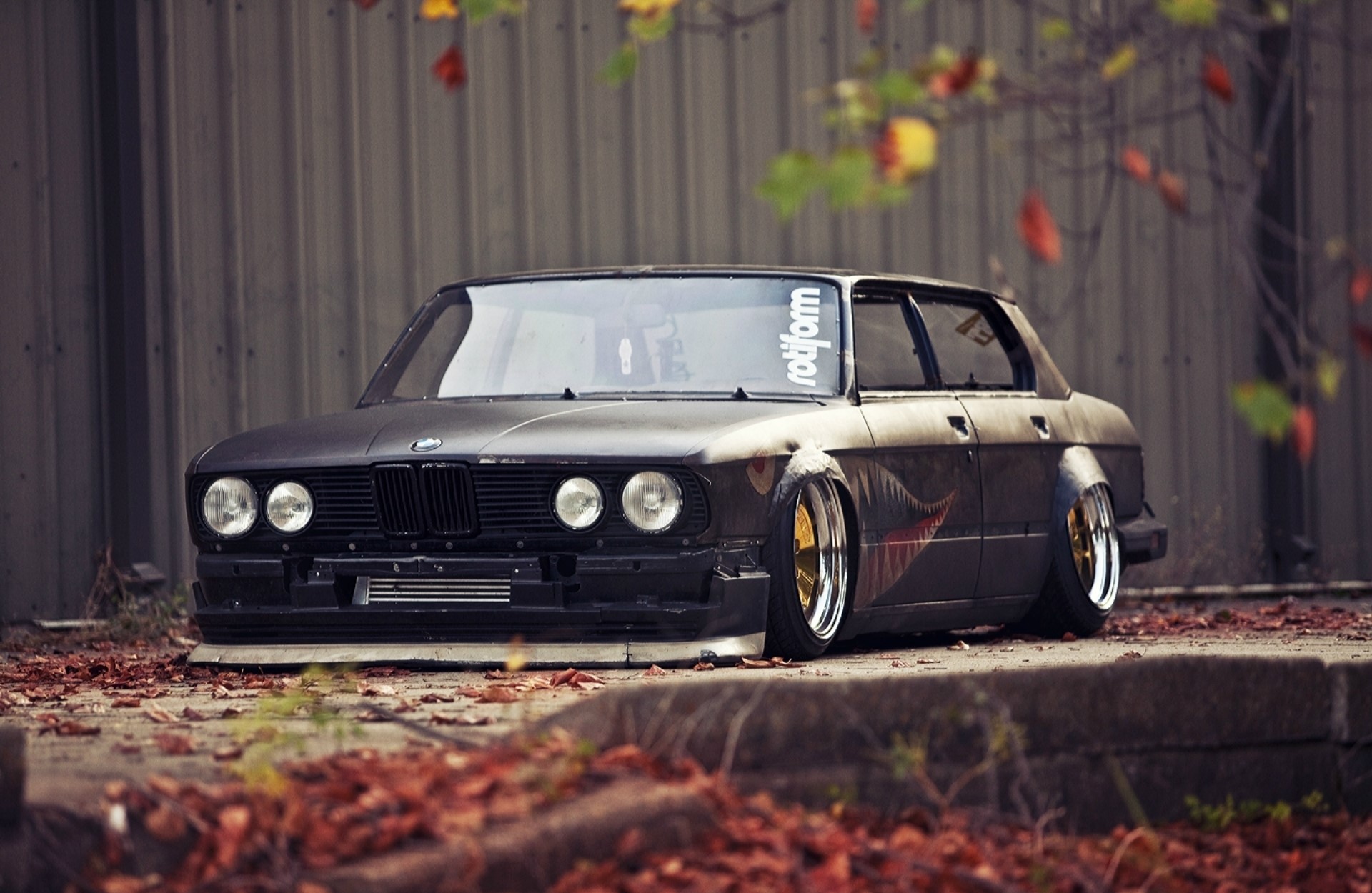 Matte black BMW E30 sedan with Rotiform sticker HD Wallpaper
