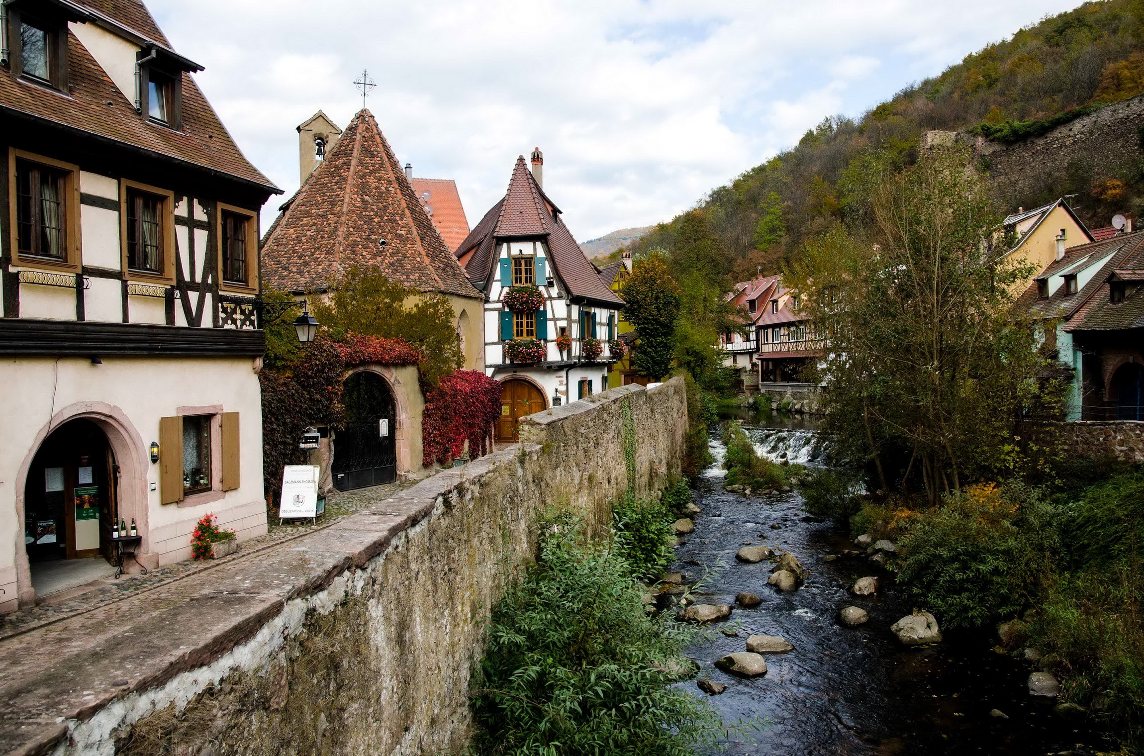 Alsace village with river and half-timbered houses HD Wallpaper