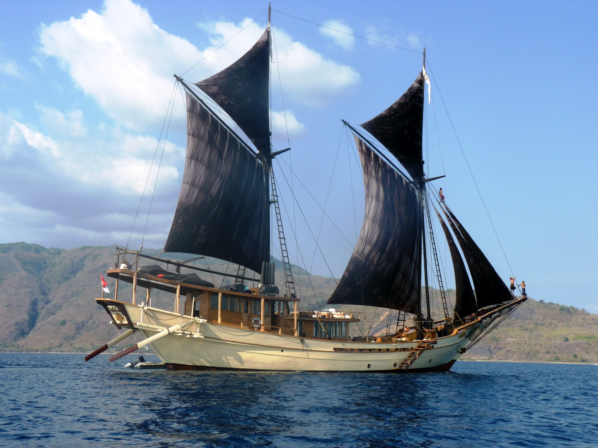 Sailing ship with black sails on the water HD Wallpaper