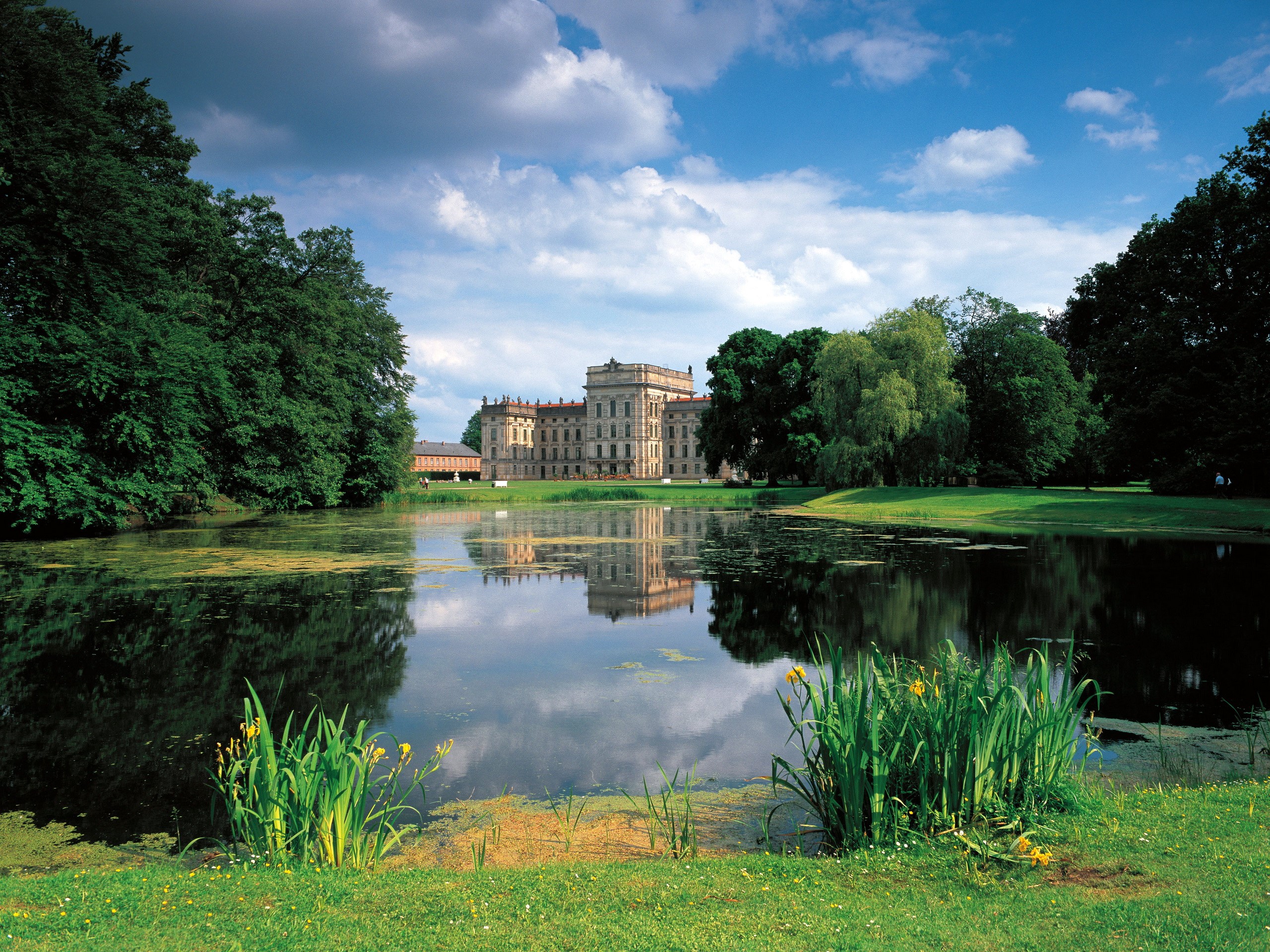 Schloss Ludwigslust castle reflected in a lake in Germany HD Wallpaper