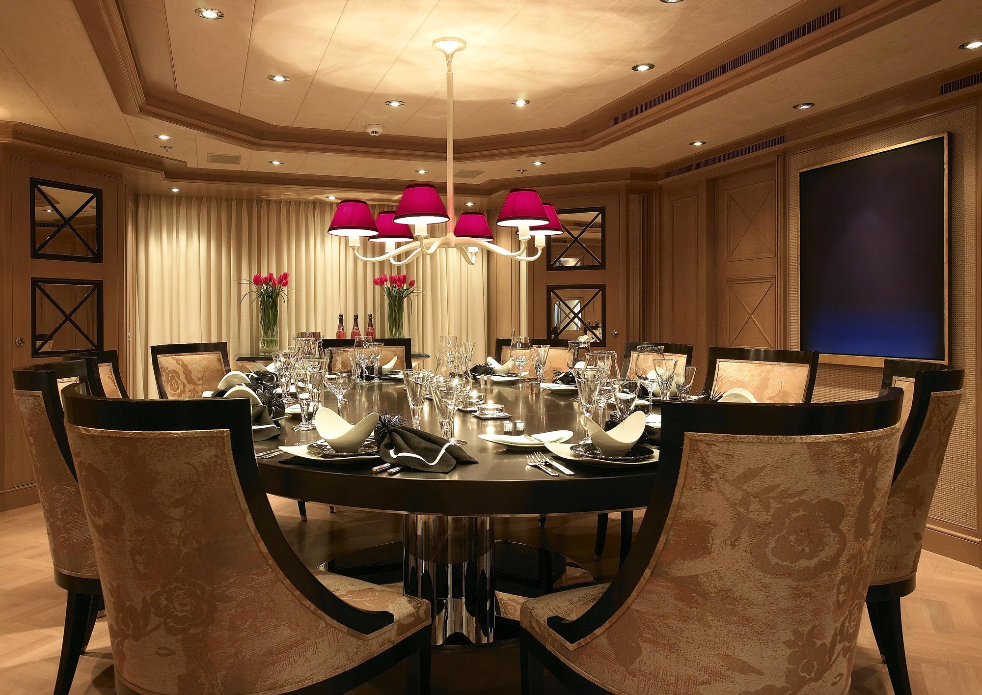 Elegant dining room with round table and chandelier HD Wallpaper