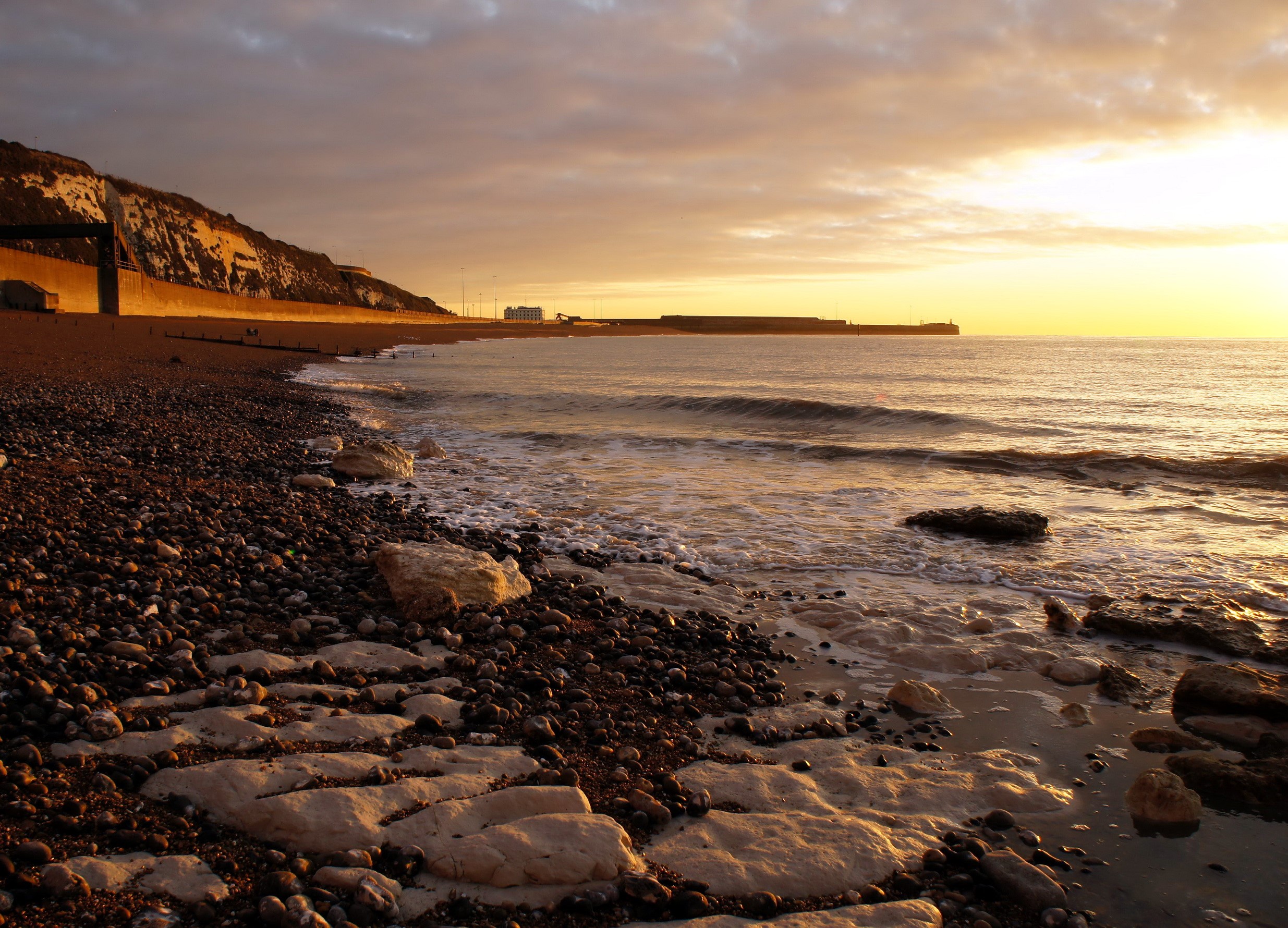 Coastline with cliffs and sea at sunset HD Wallpaper