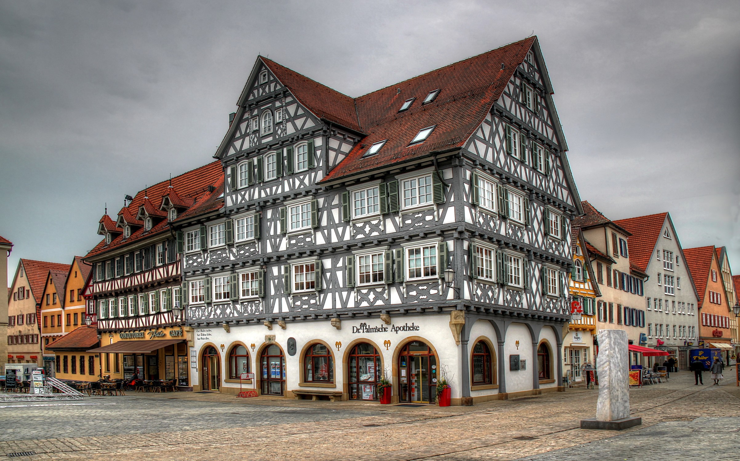 Half-timbered buildings in a German town square HD Wallpaper