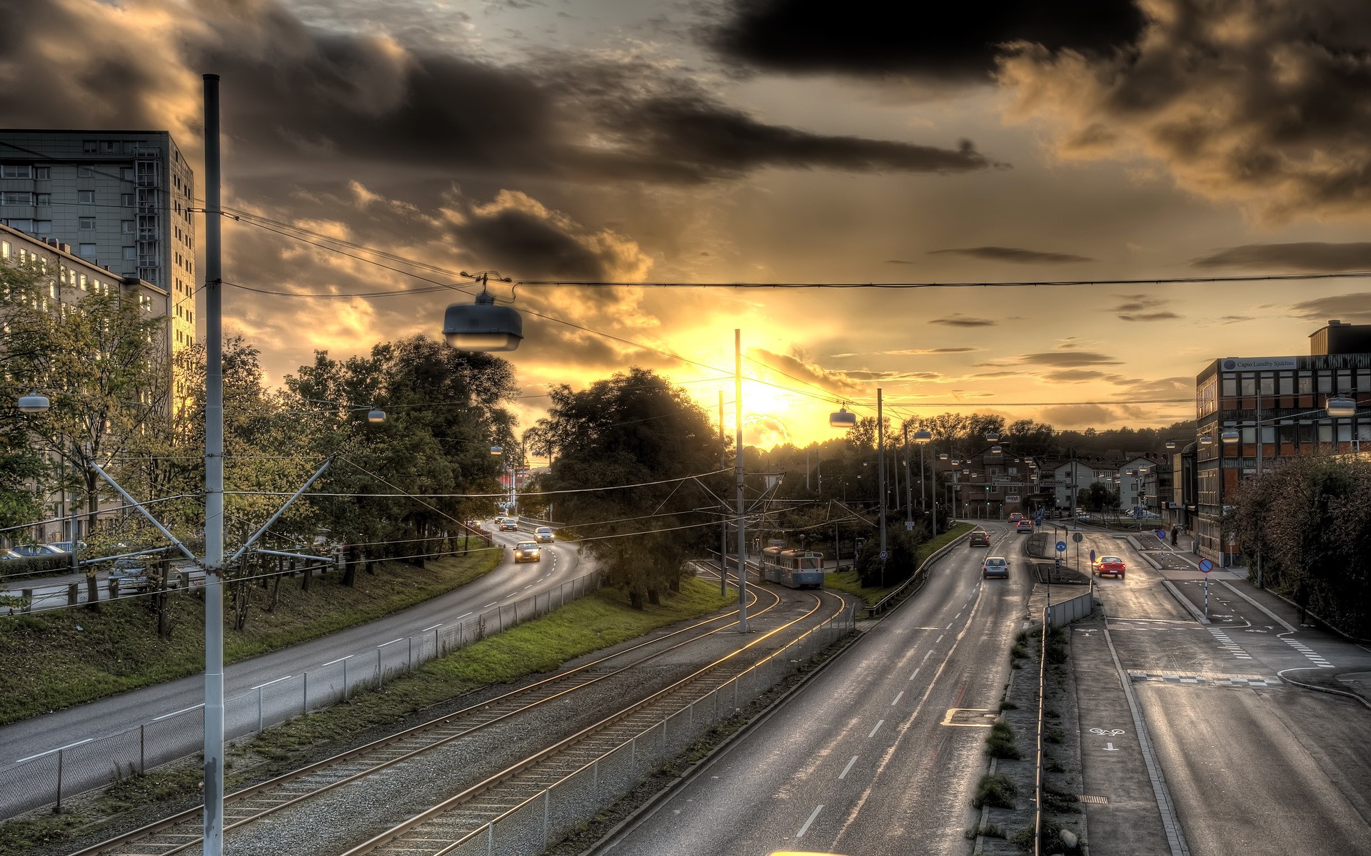 Roads and tram in Sweden at sunset HD Wallpaper