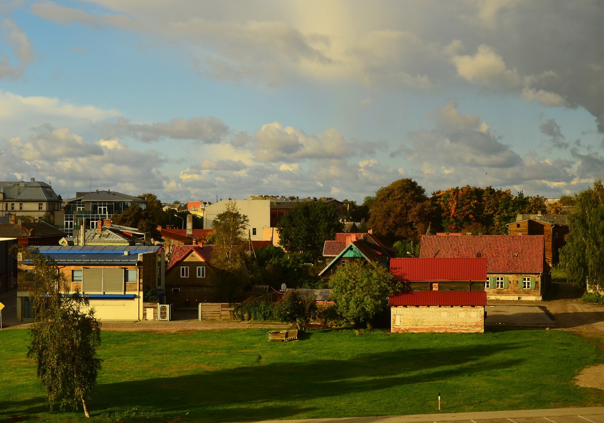 Baltic town with houses and clouds HD Wallpaper