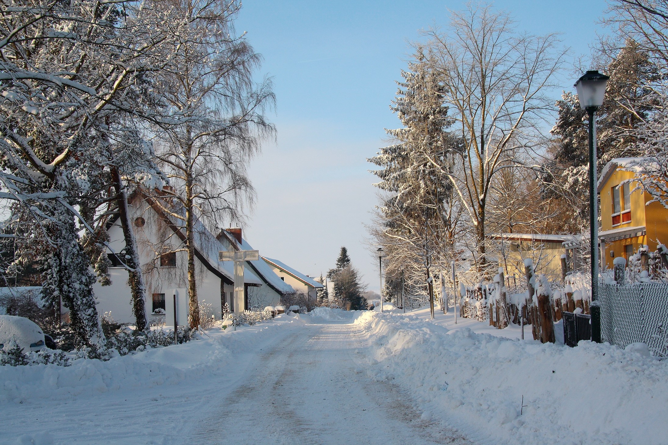 Snowy street in a German village in winter HD Wallpaper