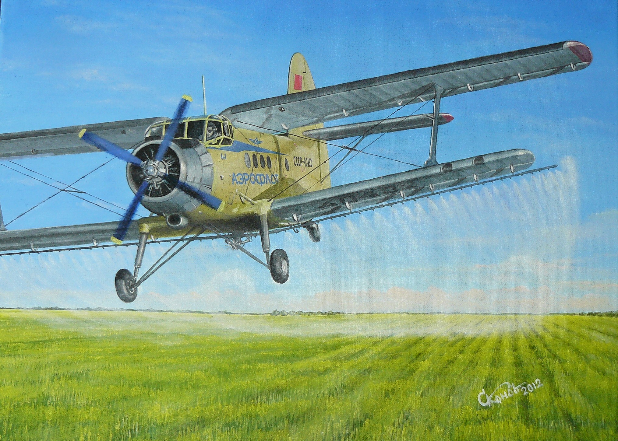 Biplane spraying crops over a field HD Wallpaper