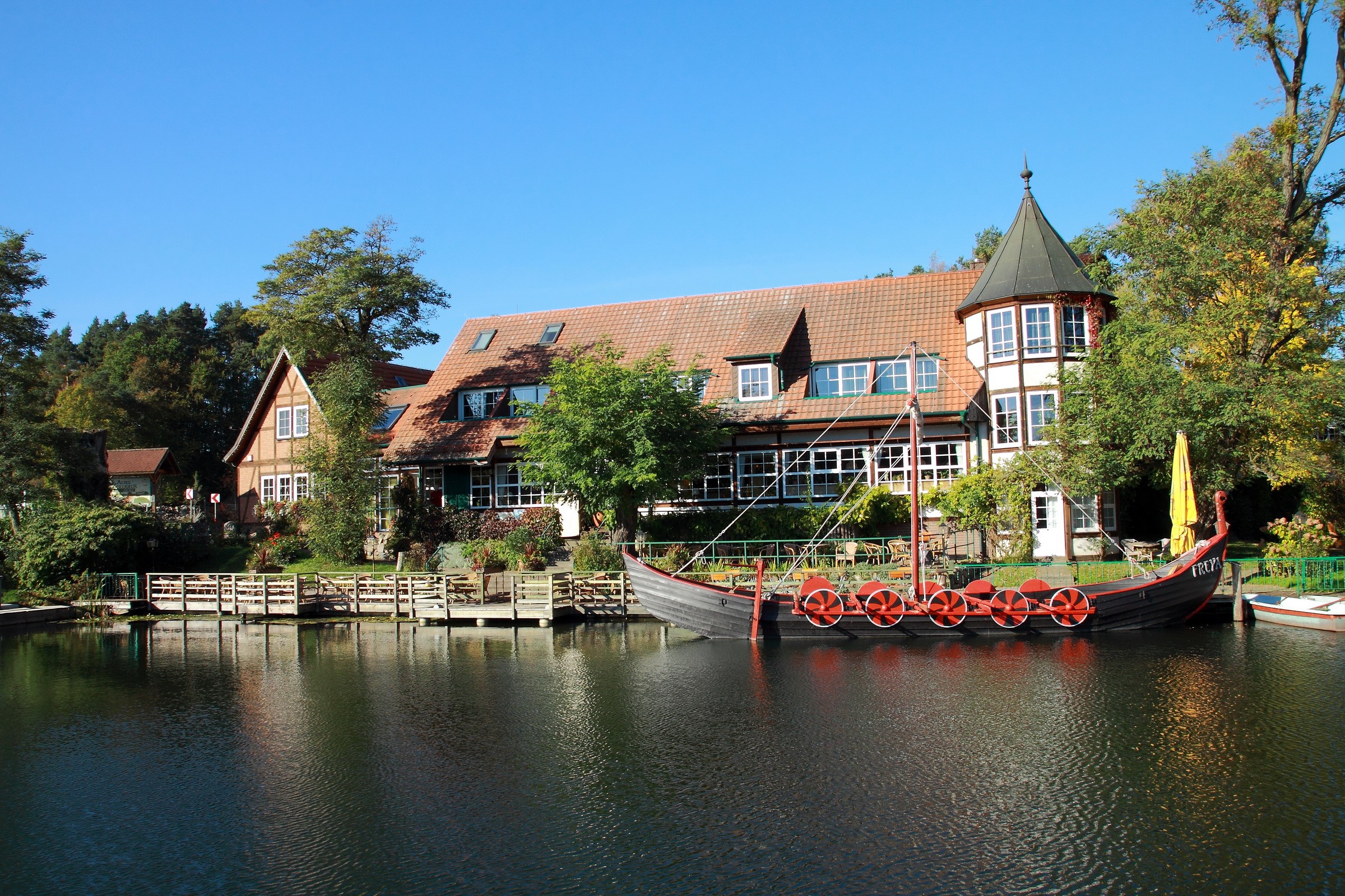 Viking ship docked by a building in Germany HD Wallpaper