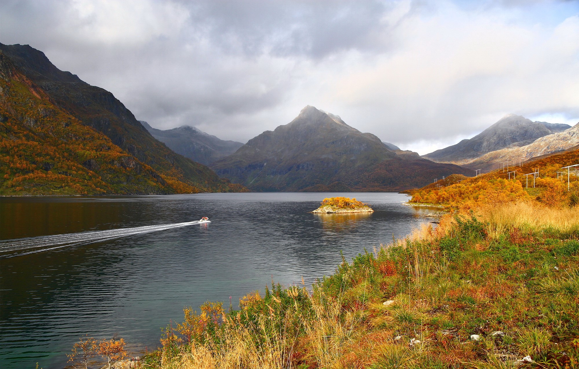 Boat on a lake in Norway during autumn HD Wallpaper