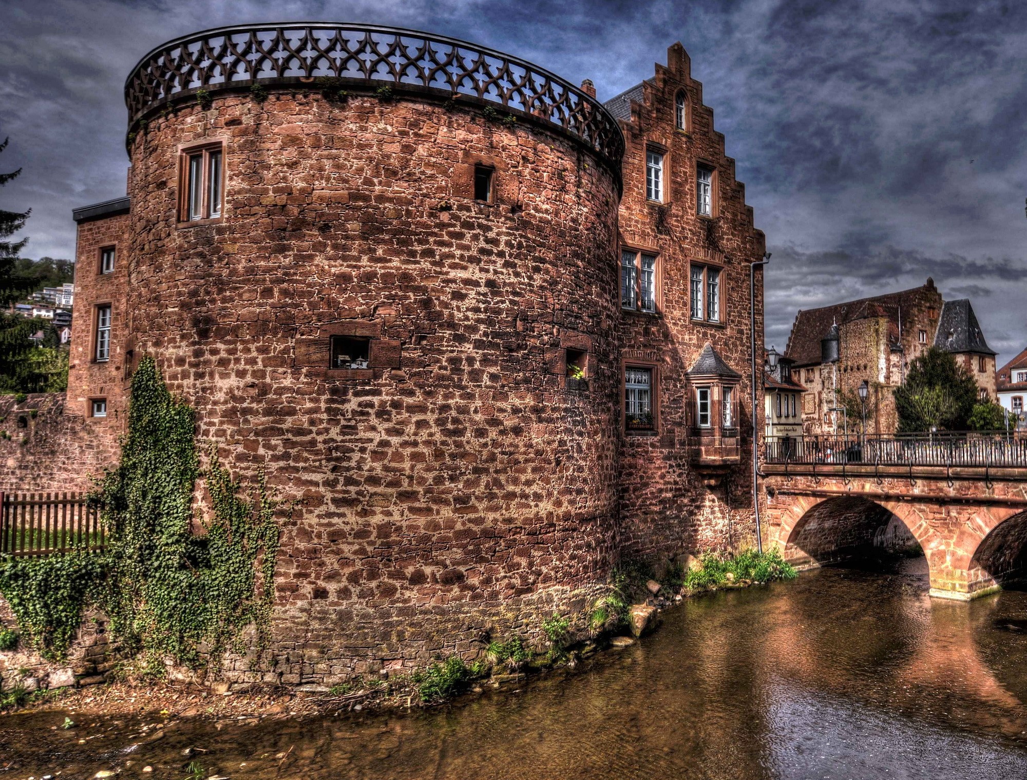 Historic stone building with bridge over river in Germany HD Wallpaper