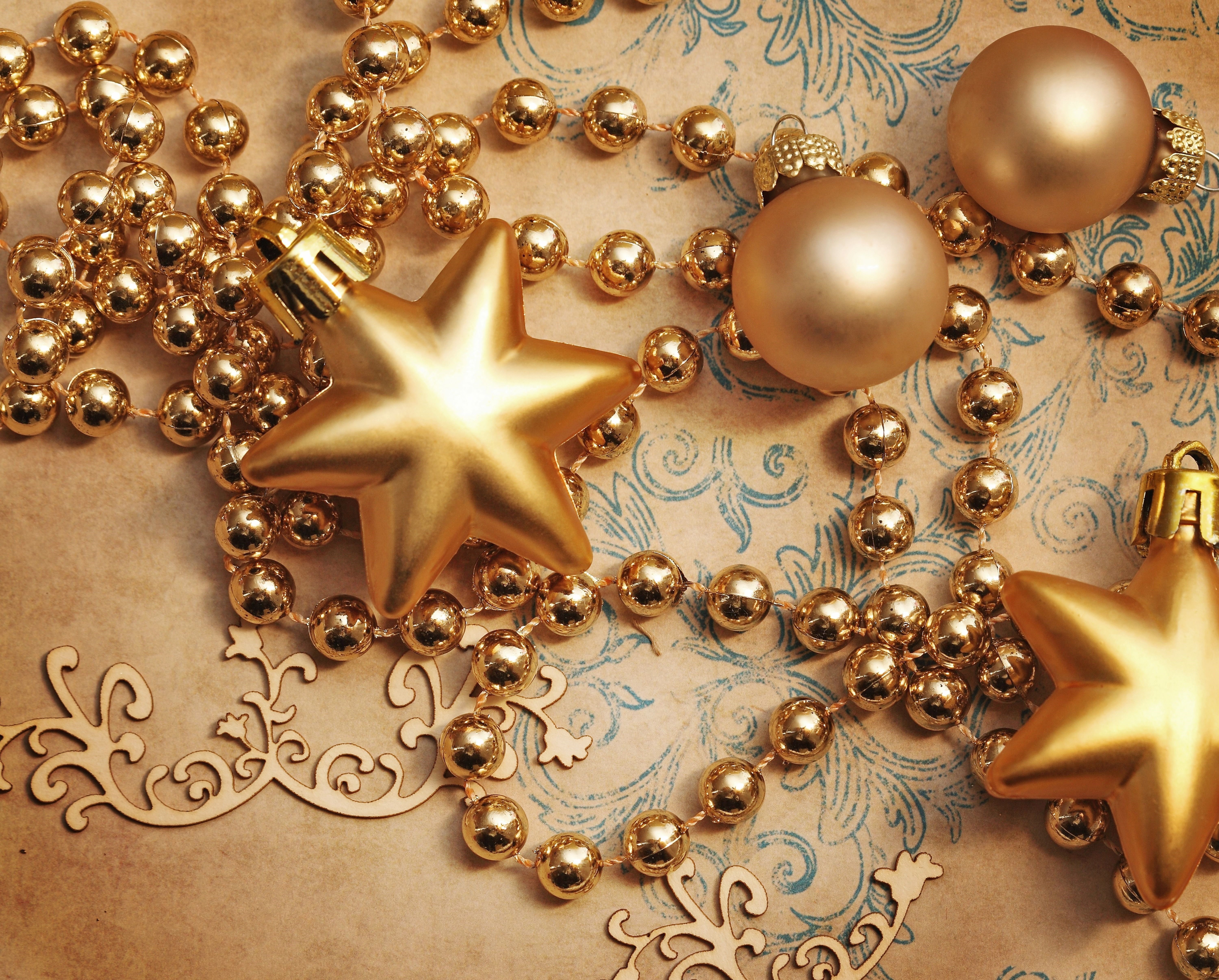 Christmas ornaments and beads on parchment HD Wallpaper