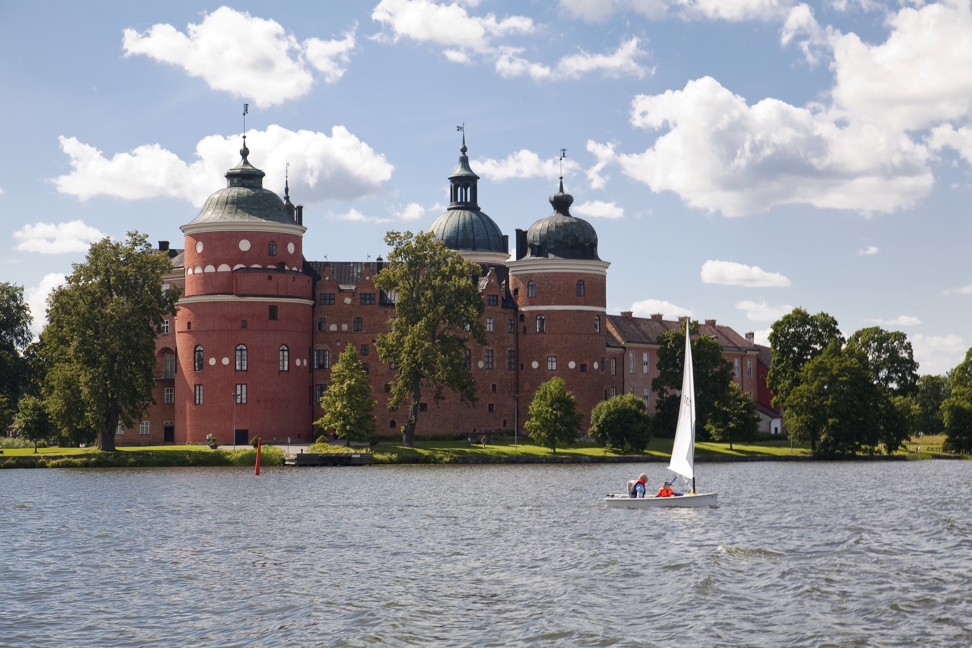 Gripsholm Castle, Sweden, with sailboat on lake HD Wallpaper
