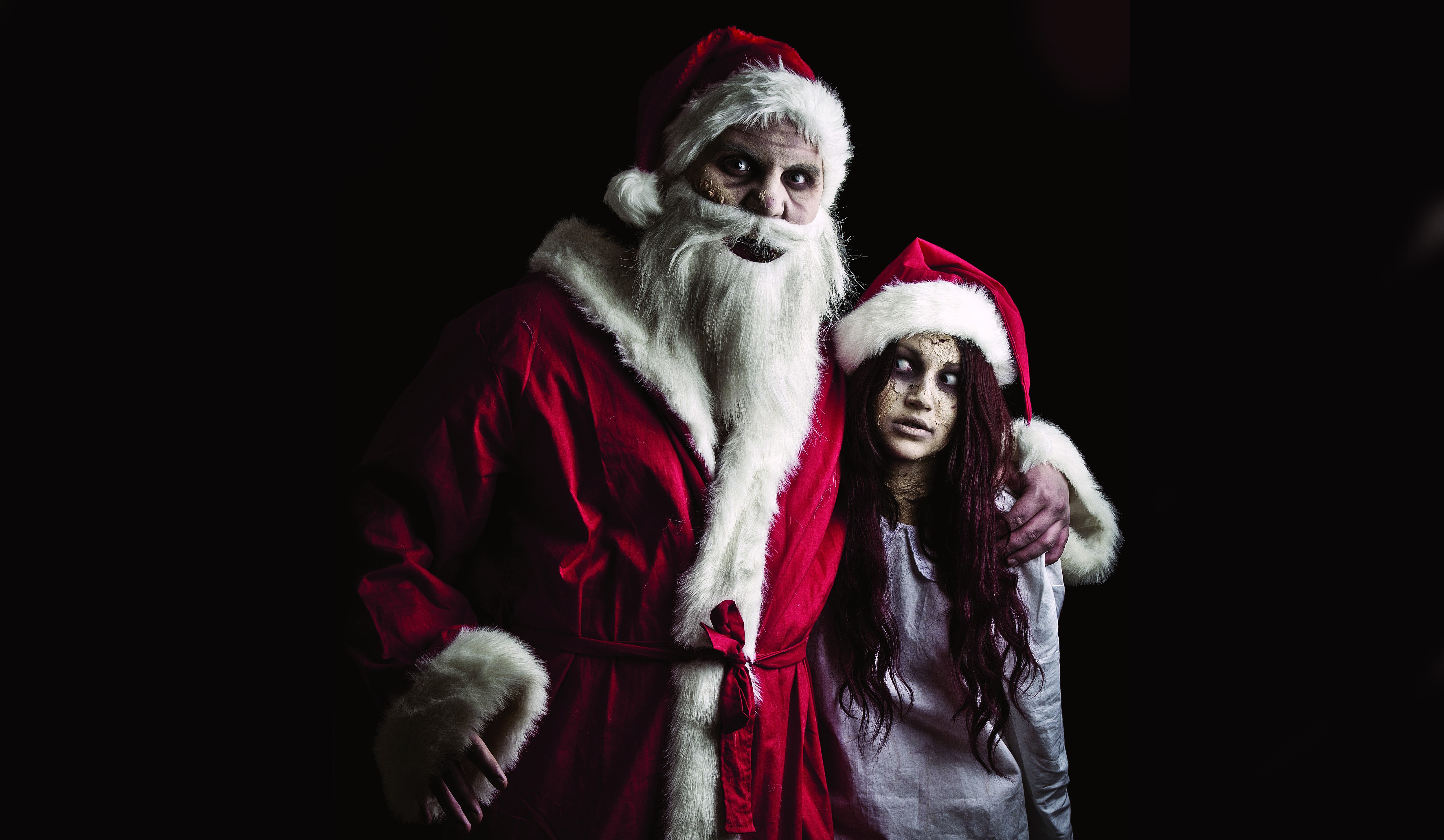 Creepy Santa Claus and Girl in Santa Hats HD Wallpaper