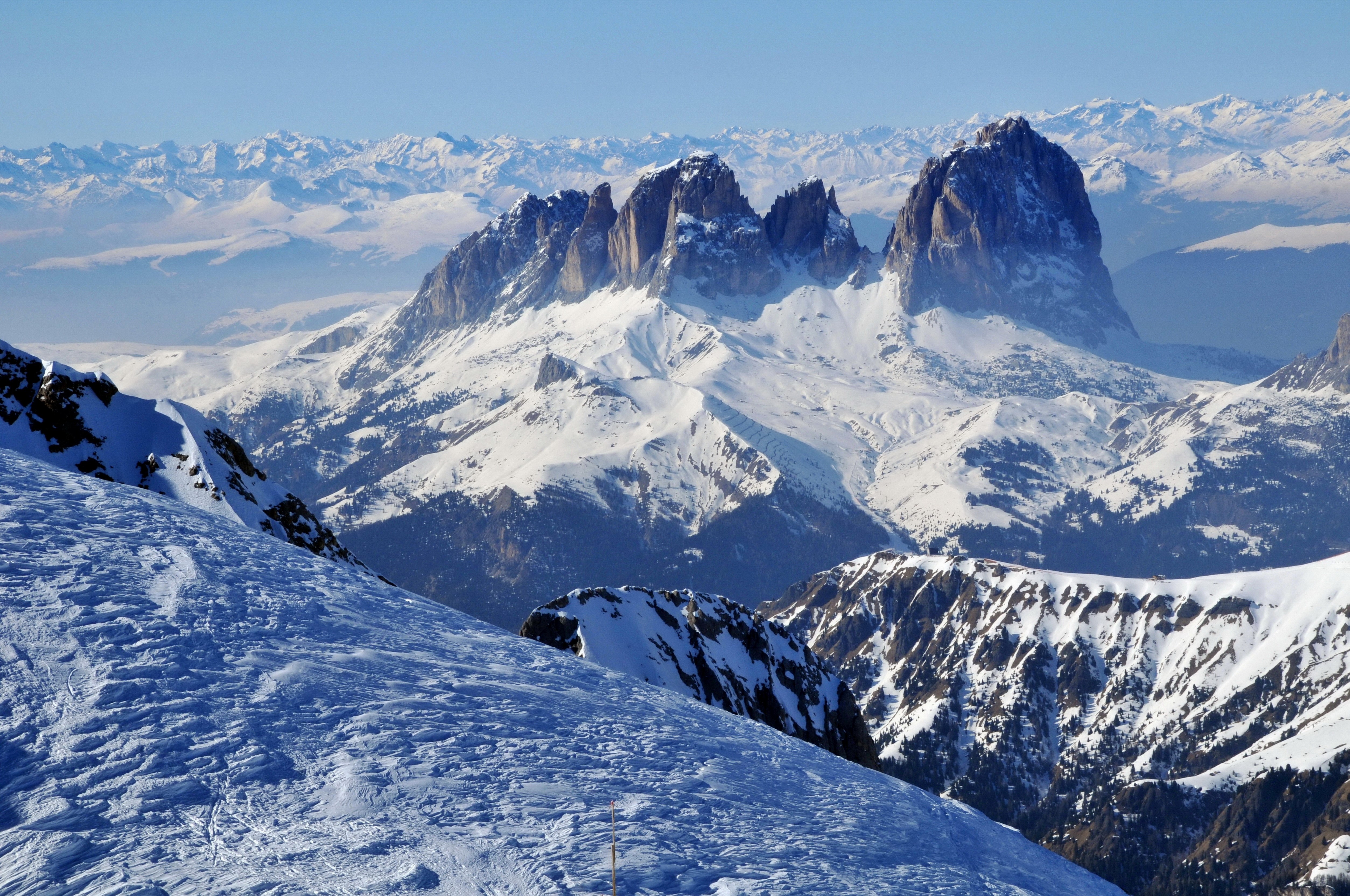 Snowy mountains and ski slope HD Wallpaper